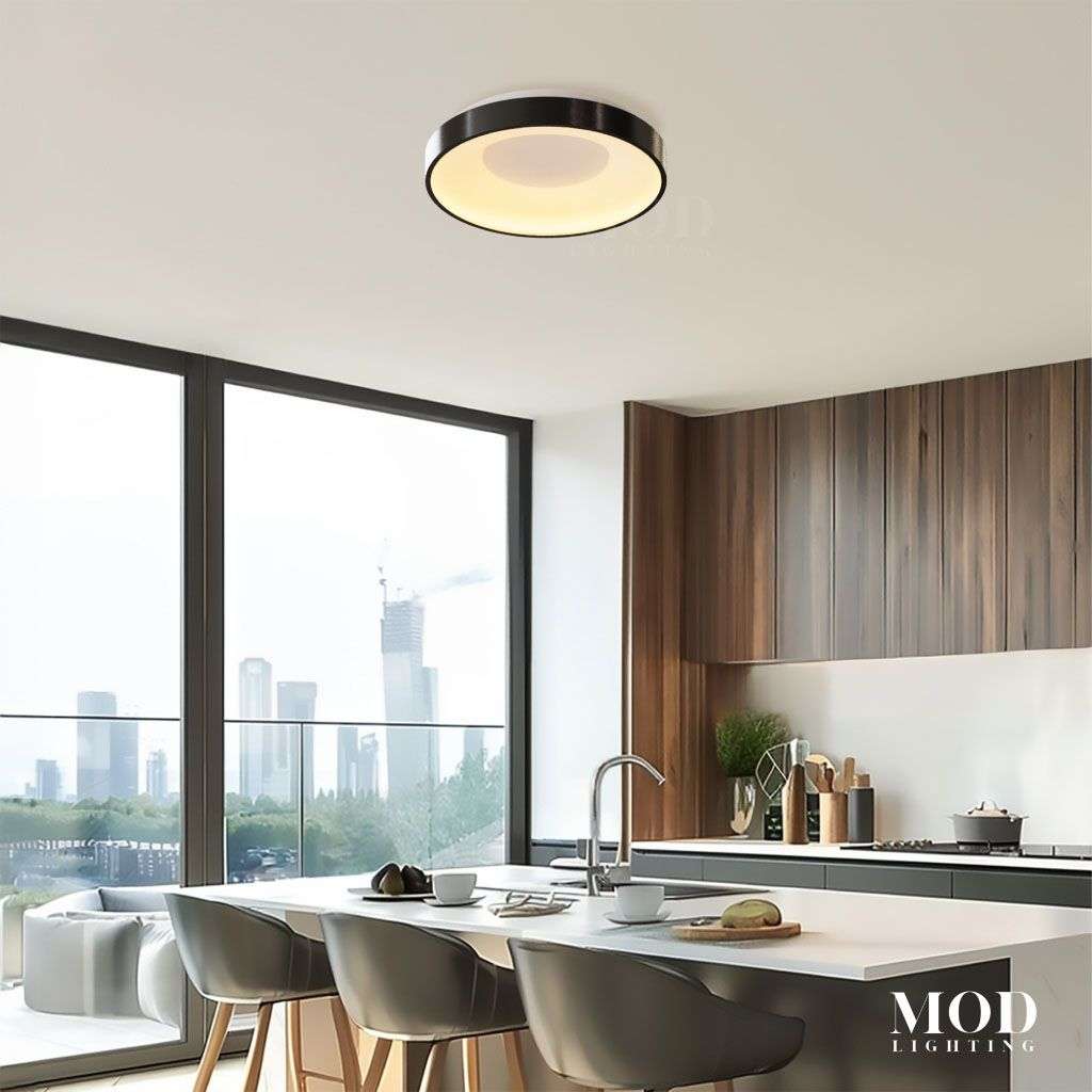 Bryce, round black and brushed-metal LED flush mount ceiling light in a kitchen with city views