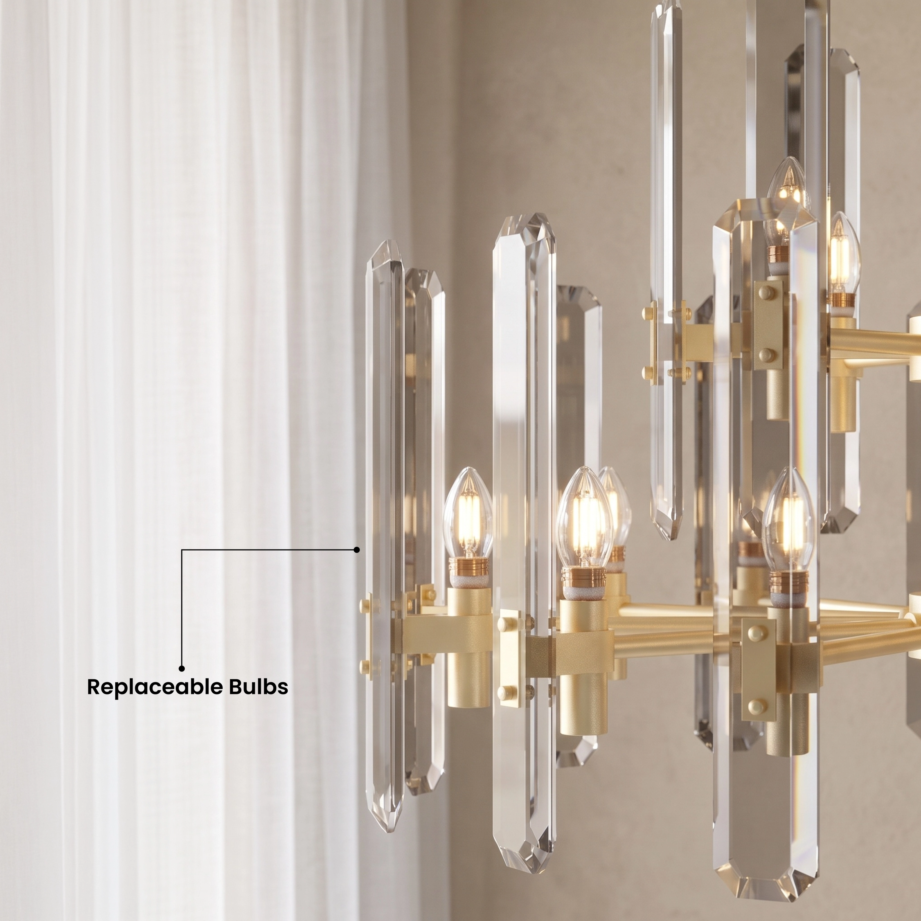 Prism brushed-gold drum chandelier with vertical faceted crystal bars over a dining table, warm-white glow
