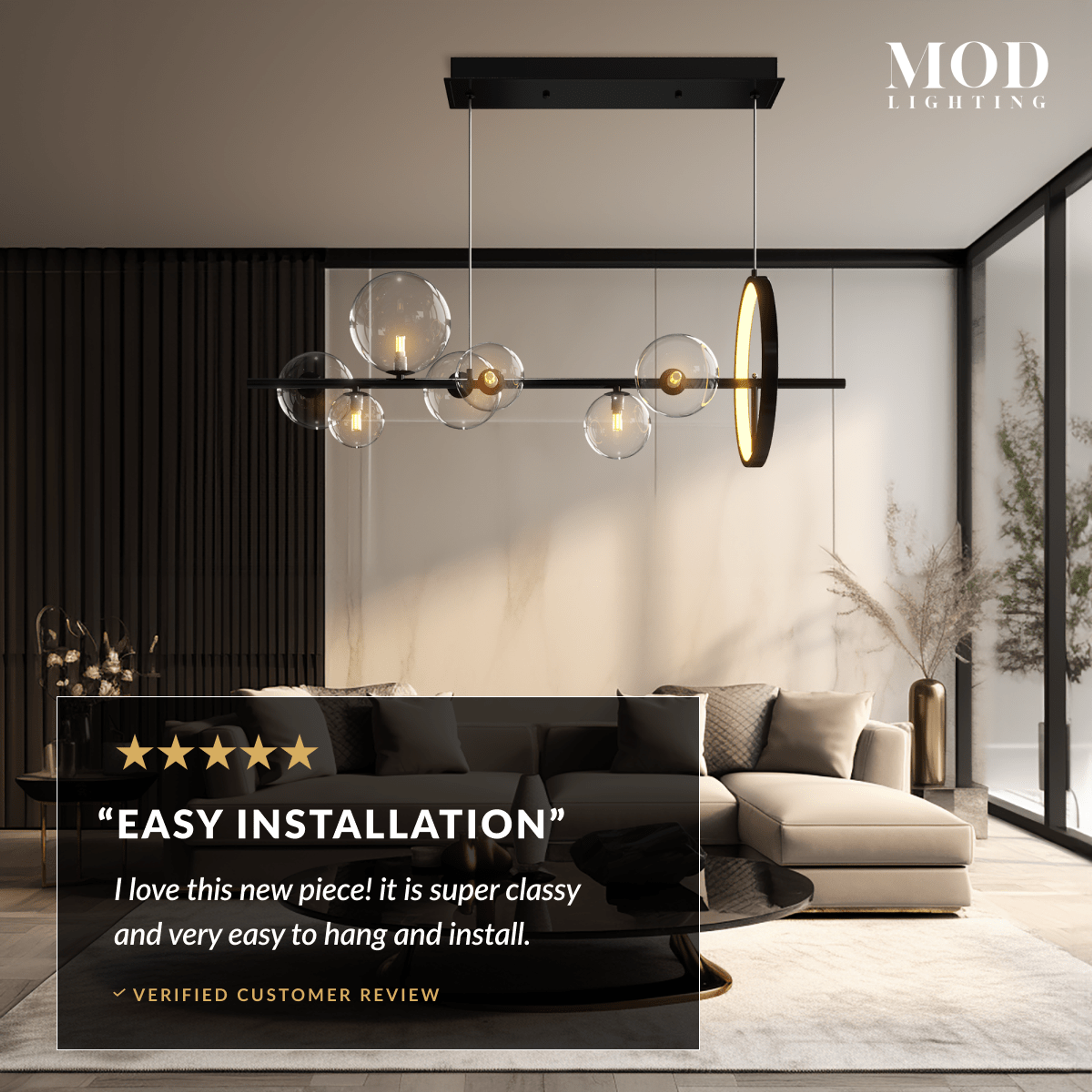 Bailey black-bar chandelier with clear glass orbs suspended in a living room with a sectional sofa