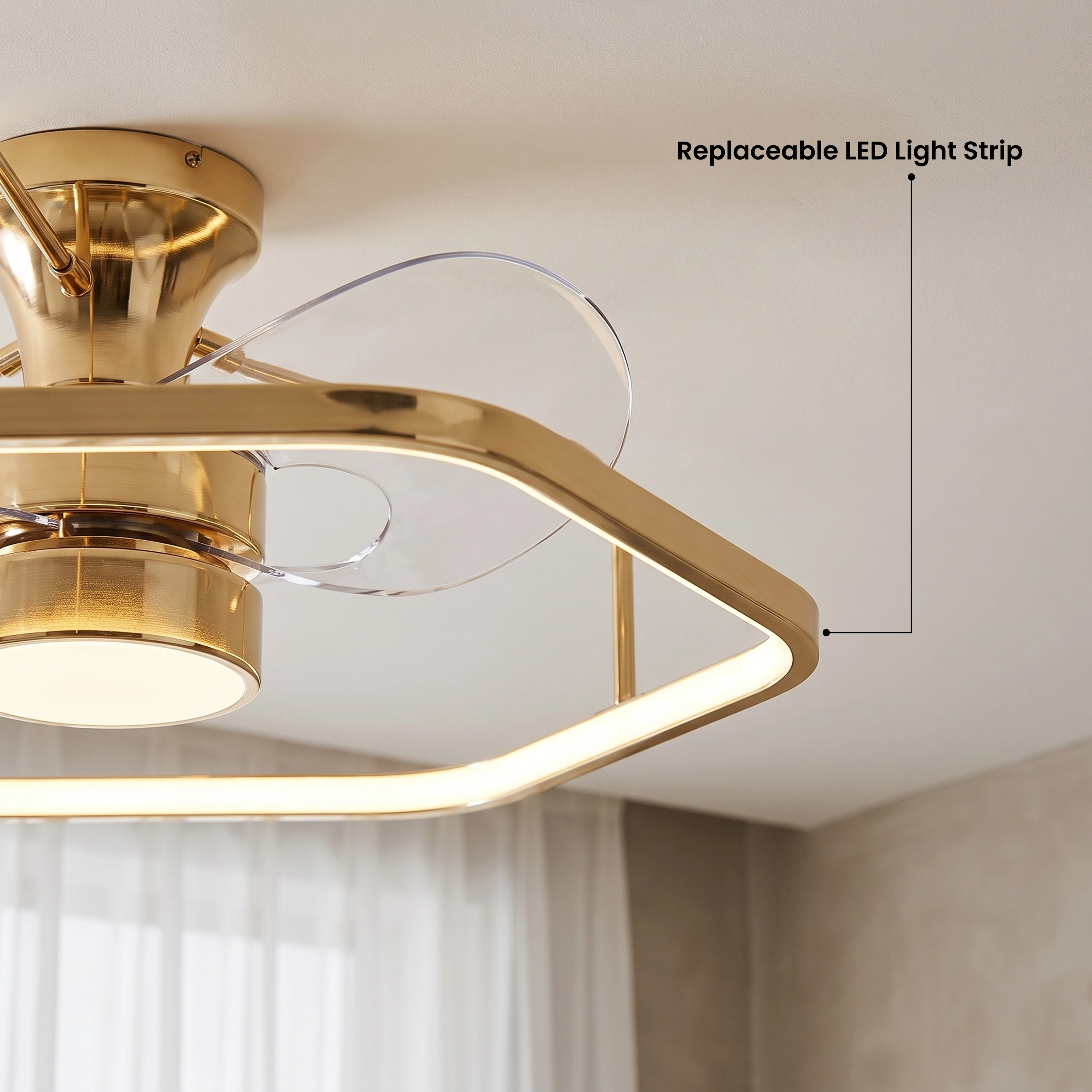 Virelle gold ceiling fan light, hexagonal ring with clear blades and glowing LED band, in a bedroom