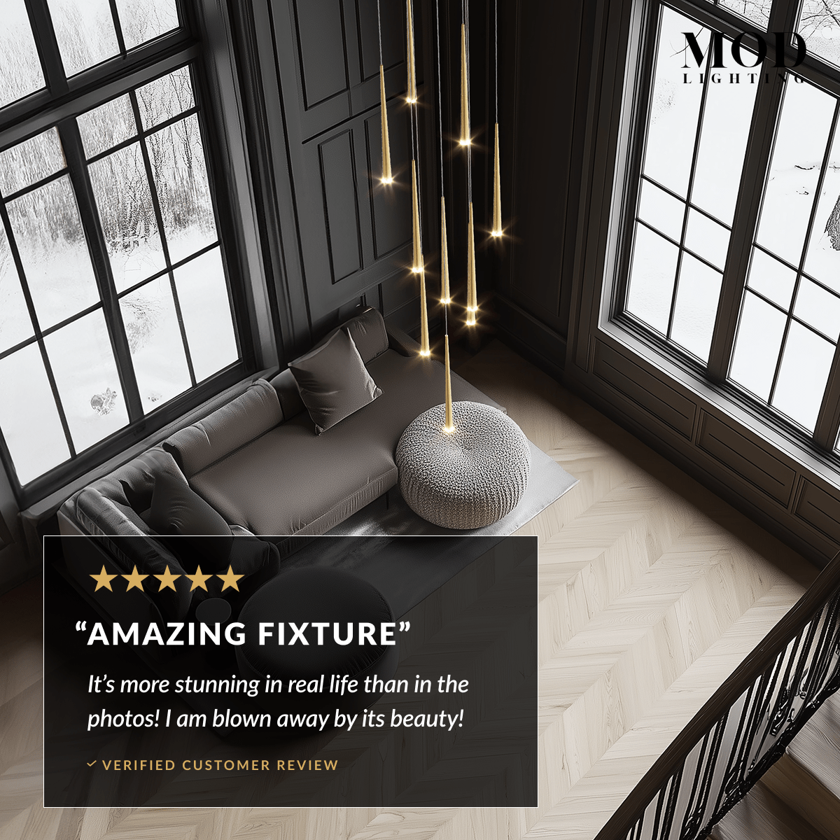 Jasper gold cascading pendants glowing in a dark-paneled corner room with snowy windows, overhead view
