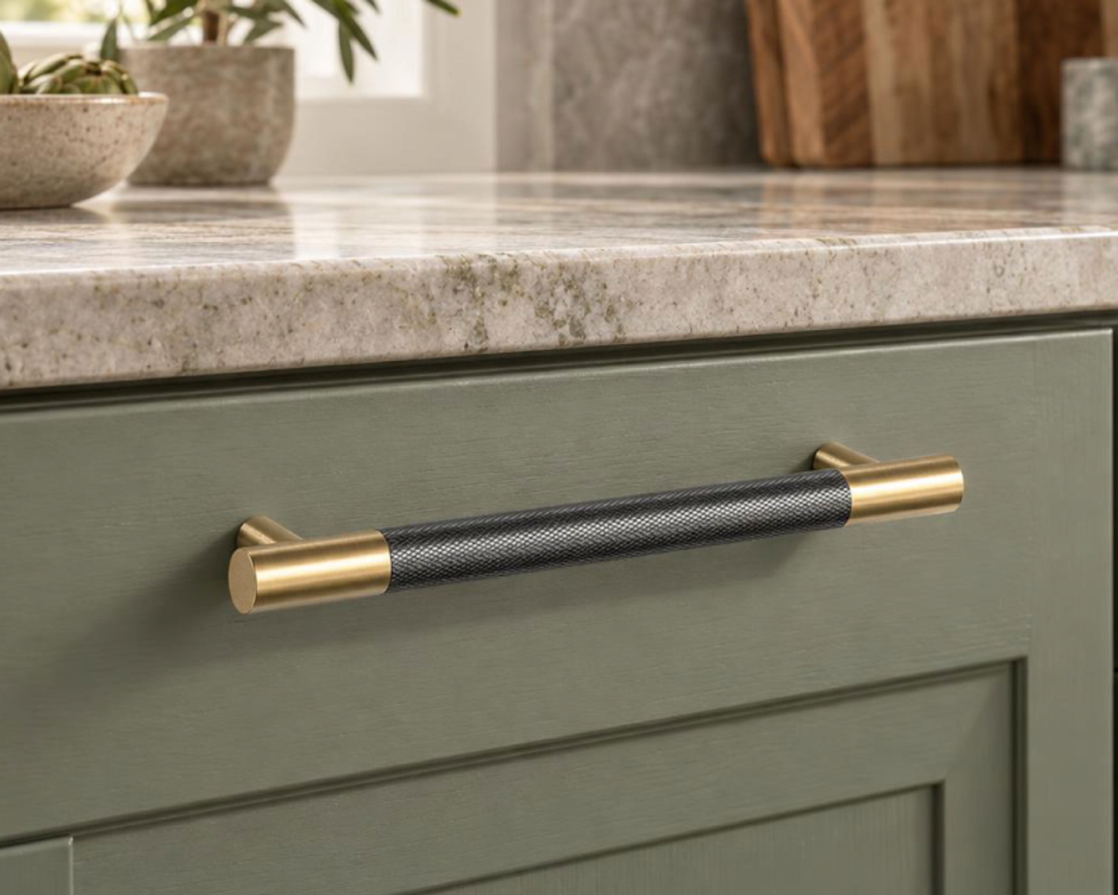 Maddison brass cabinet pull on a beige cabinet