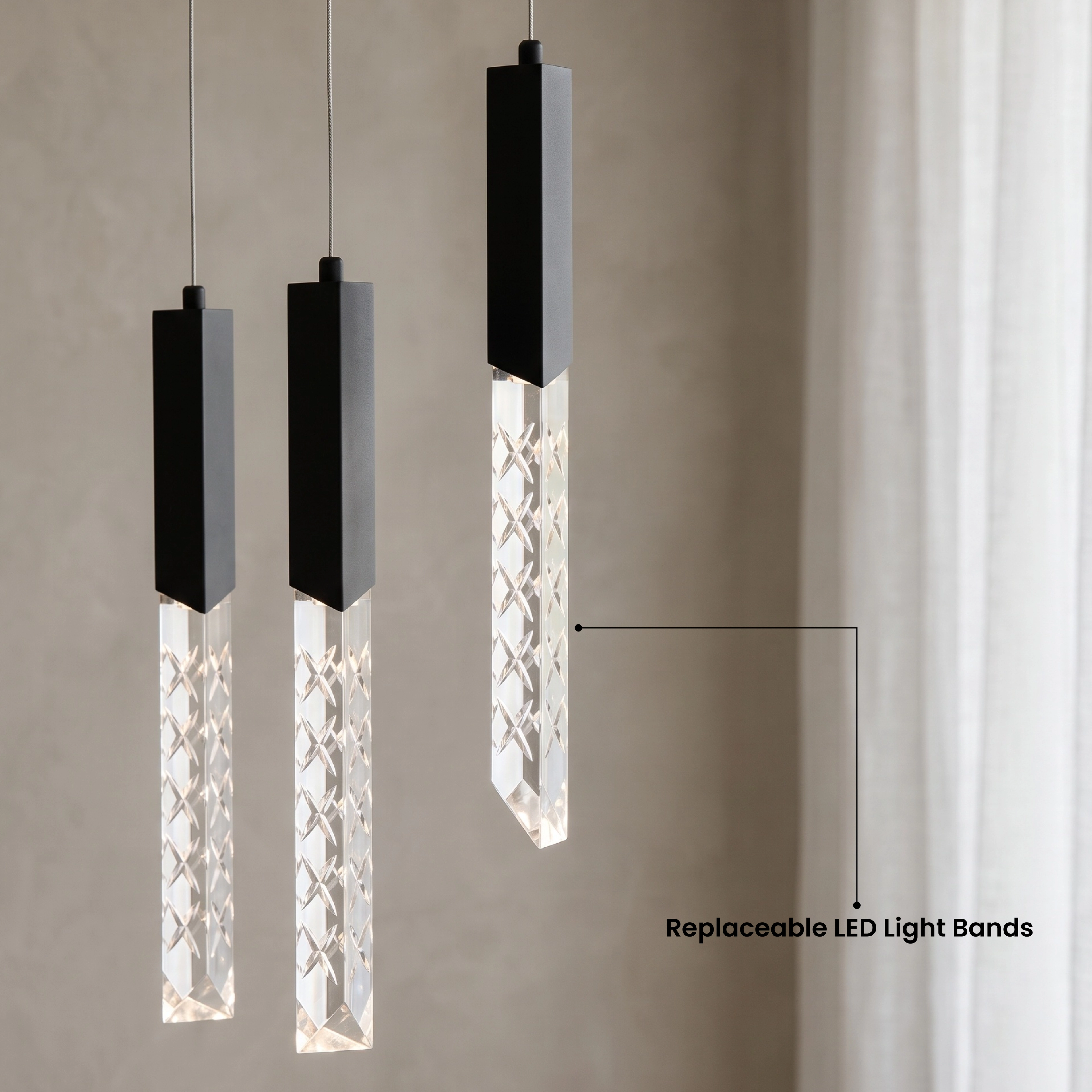 Cosmo black cascading pendants spiraling down a marble dining wall over a round table for four