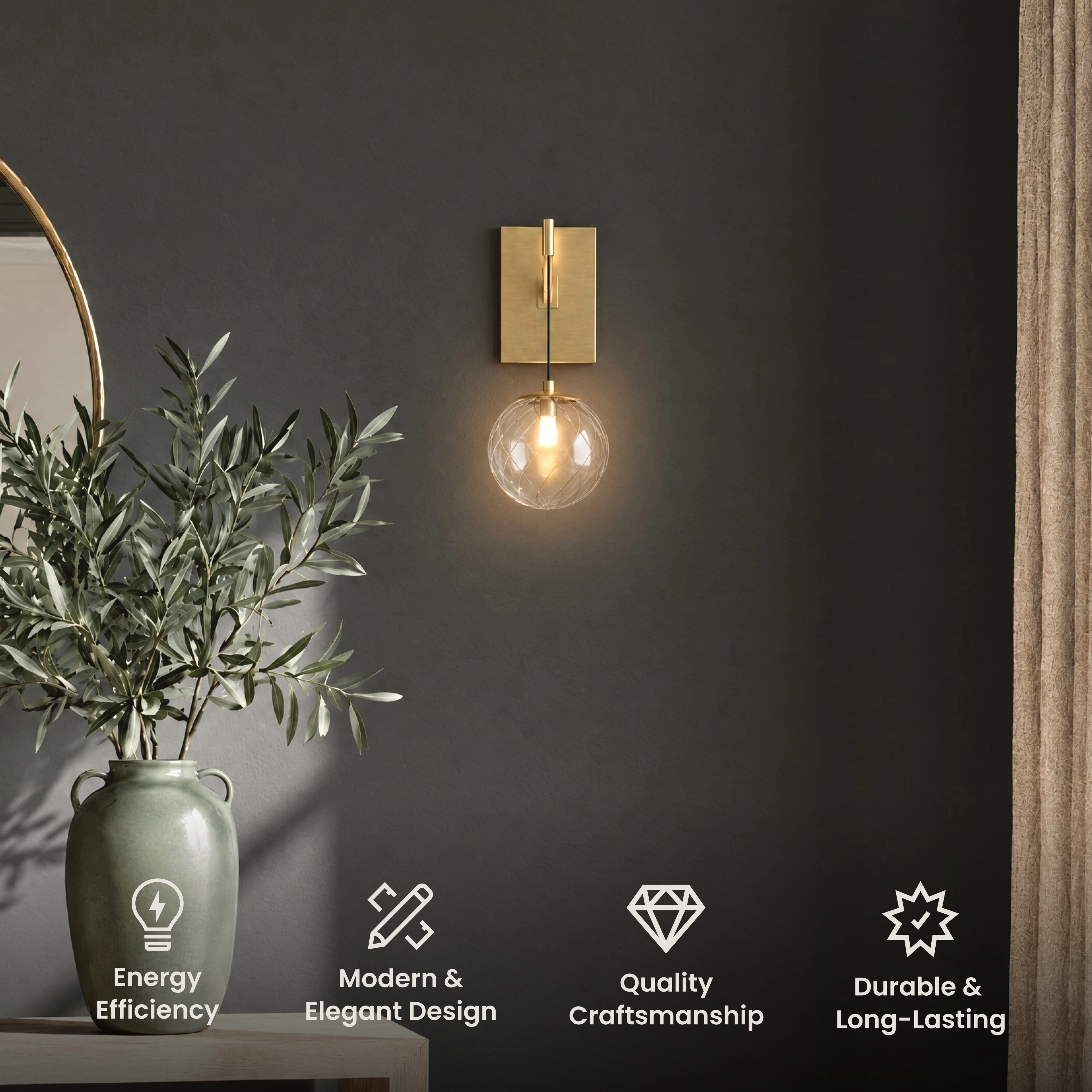 Mirella Sconce, single clear glass globe on a brushed gold wall-mounted arm