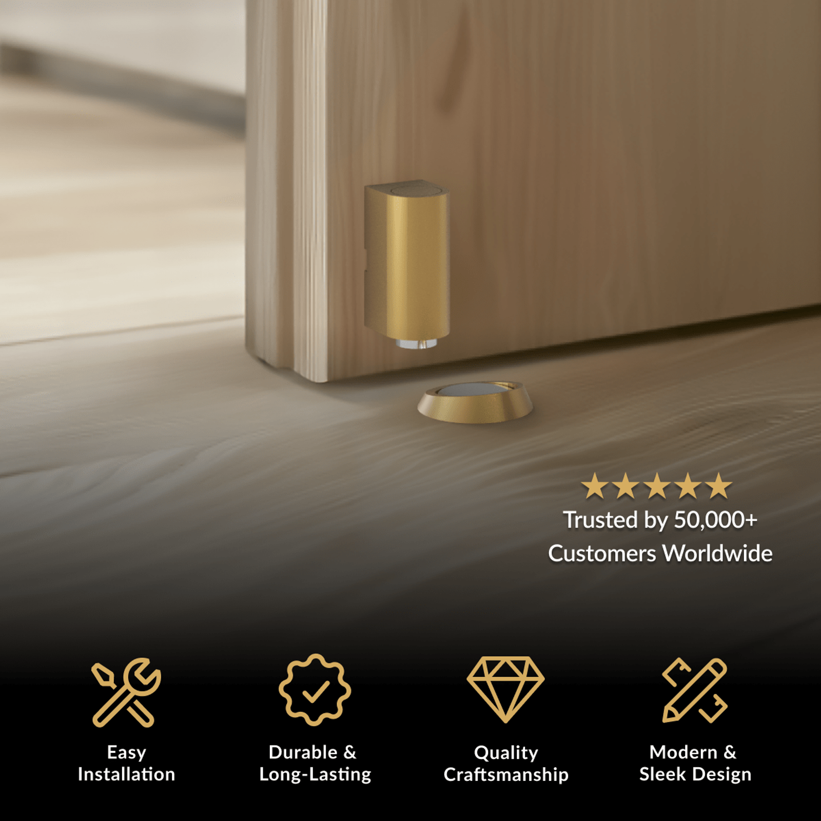 Cavo Door Stop, cylindrical brushed gold floor-mounted stop beside a wood door
