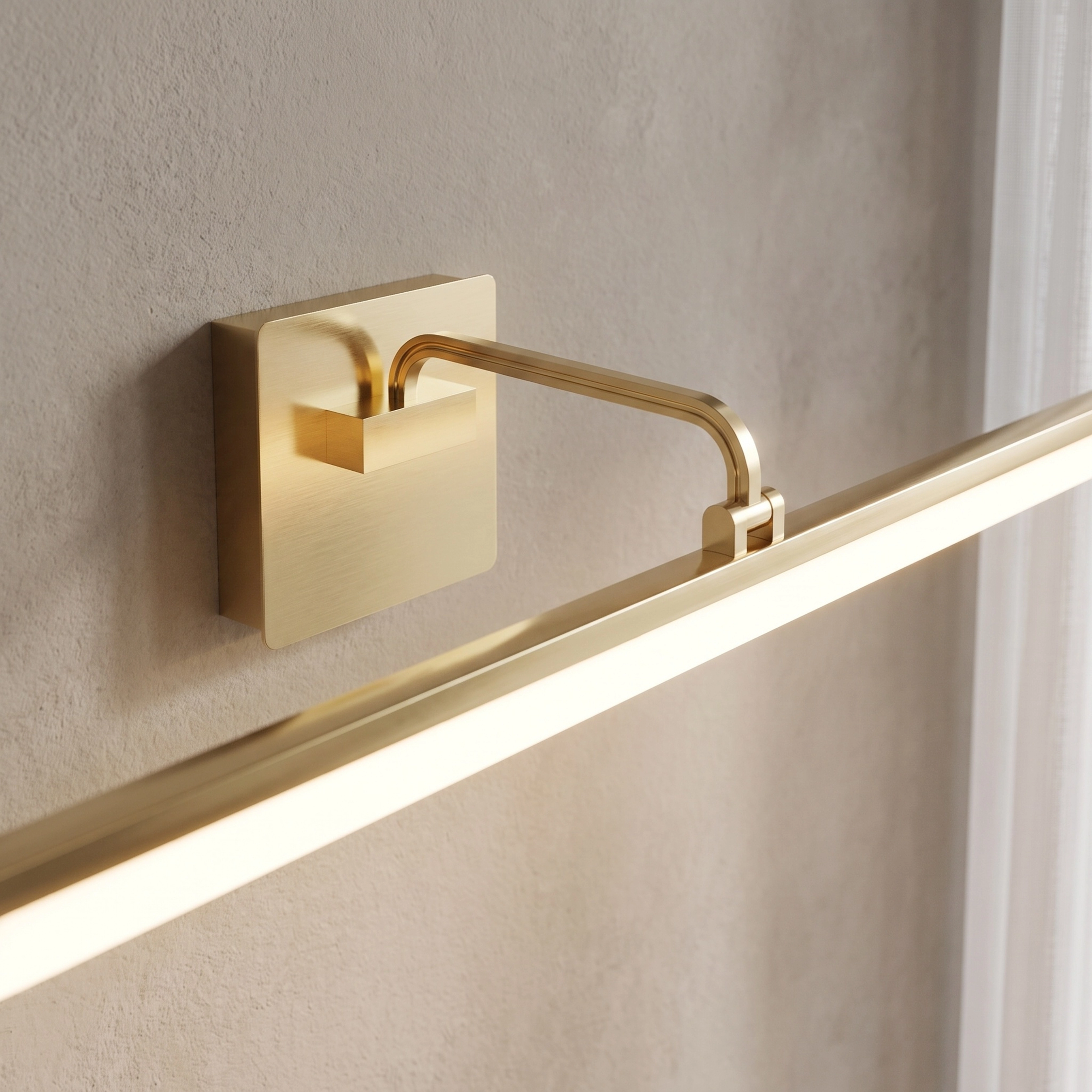 Zena slim brushed-gold horizontal bar light over a round mirror and vanity, warm white 3000K