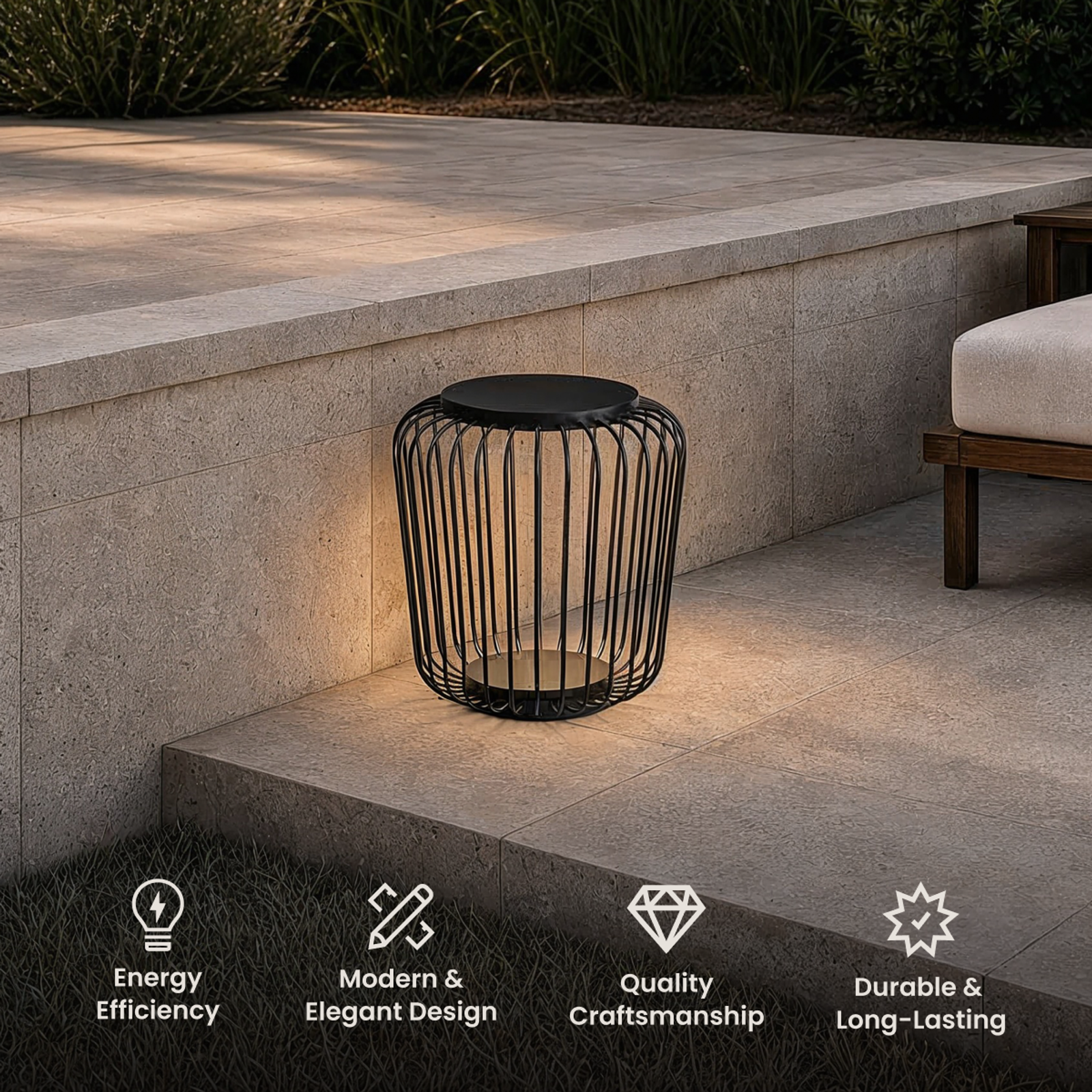 Cedar black wire-cage lantern on a stone step by an outdoor lounge, with energy, design and durability icons