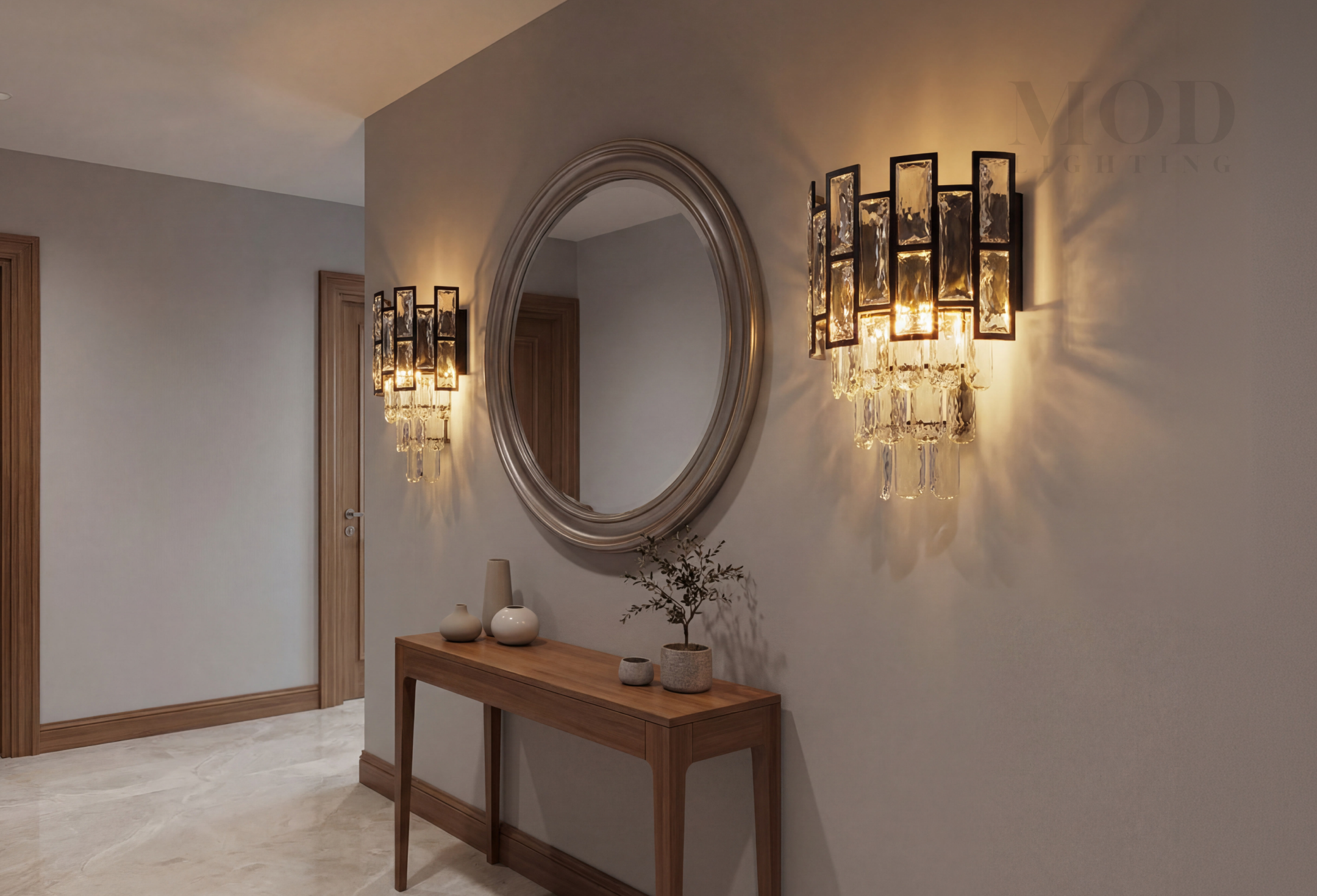 Pair of wall sconces flanking a mirror in a small entryway