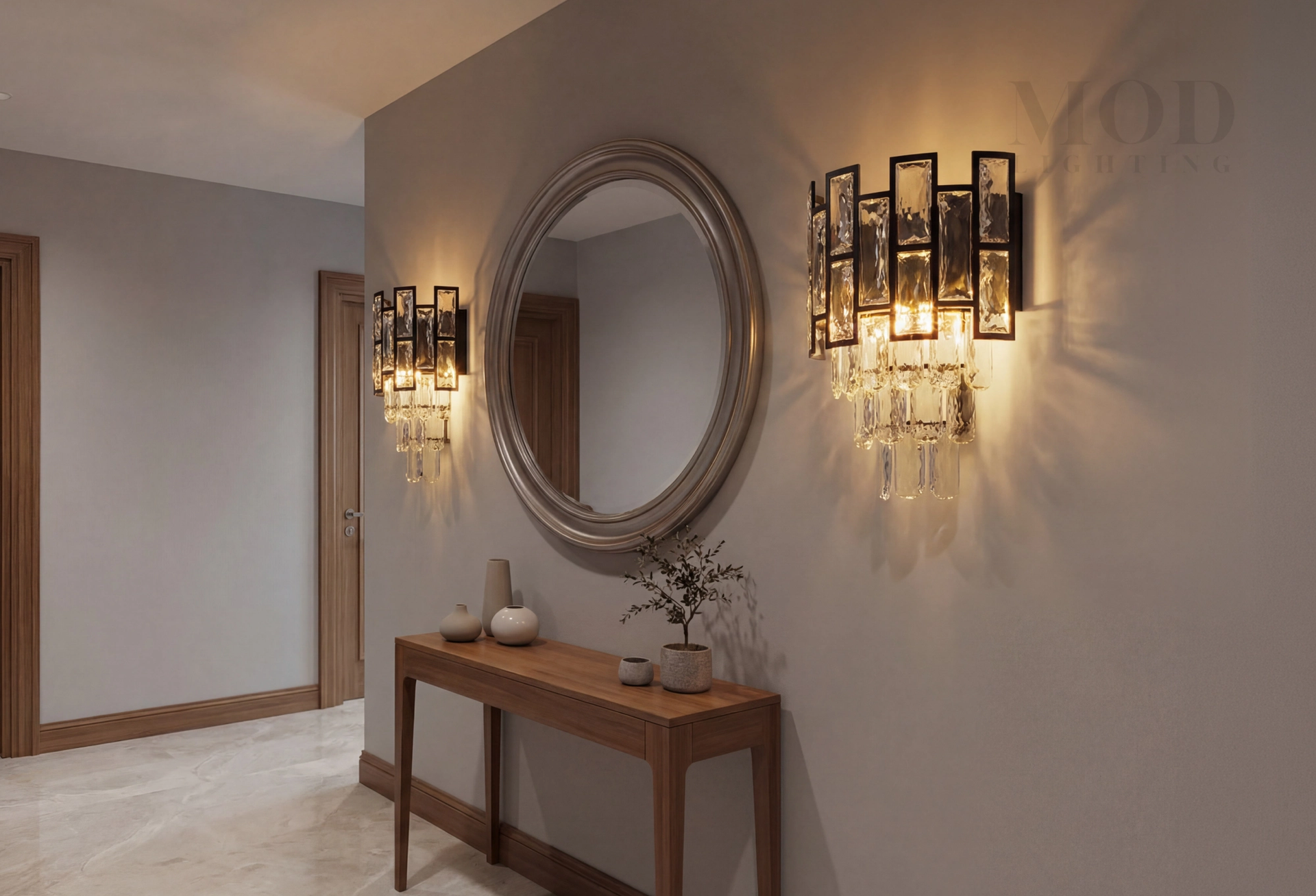 Pair of wall sconces flanking a mirror in a small entryway