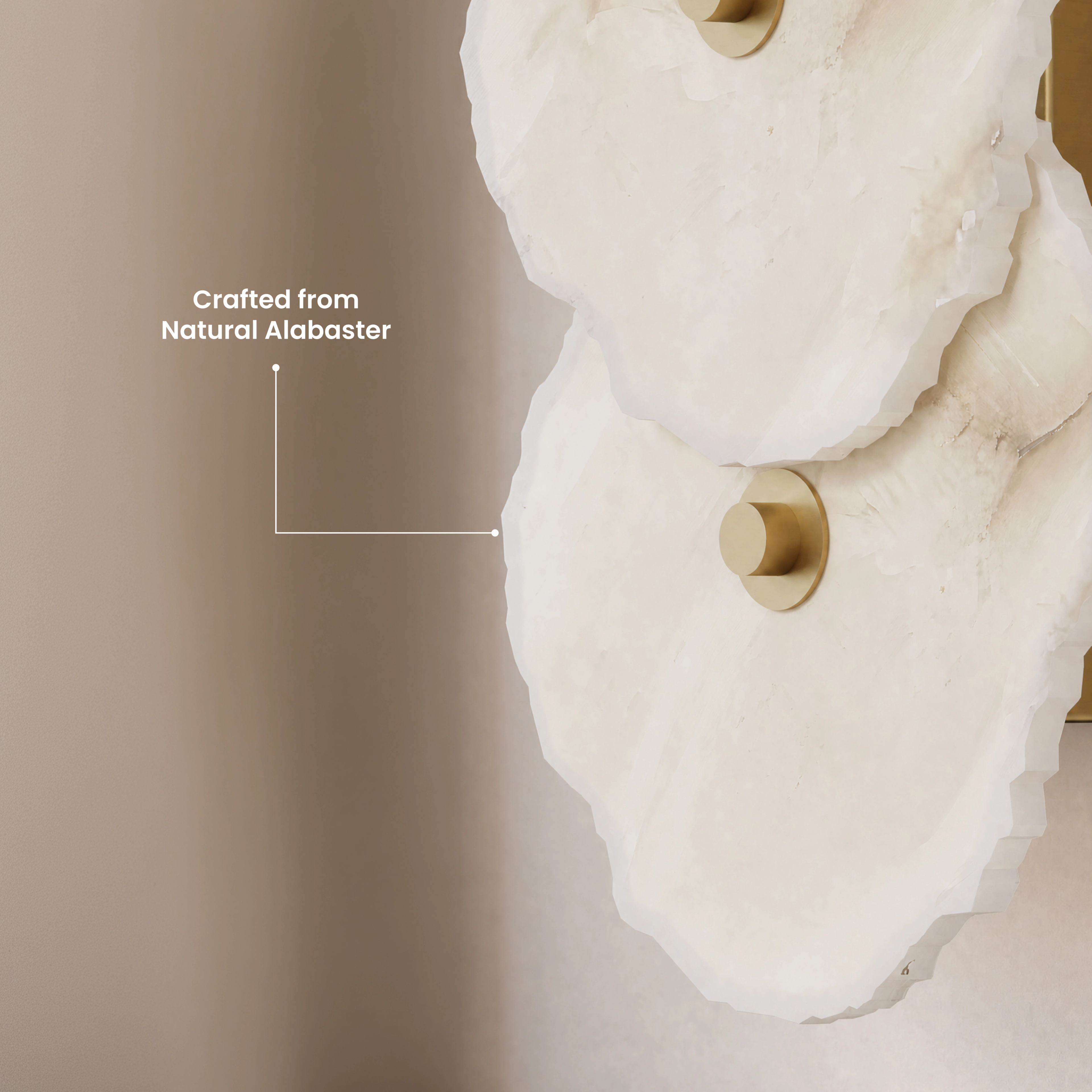 Alba Sconce pair, stacked alabaster-petal discs glowing warm white on a dining-room wall above set tables
