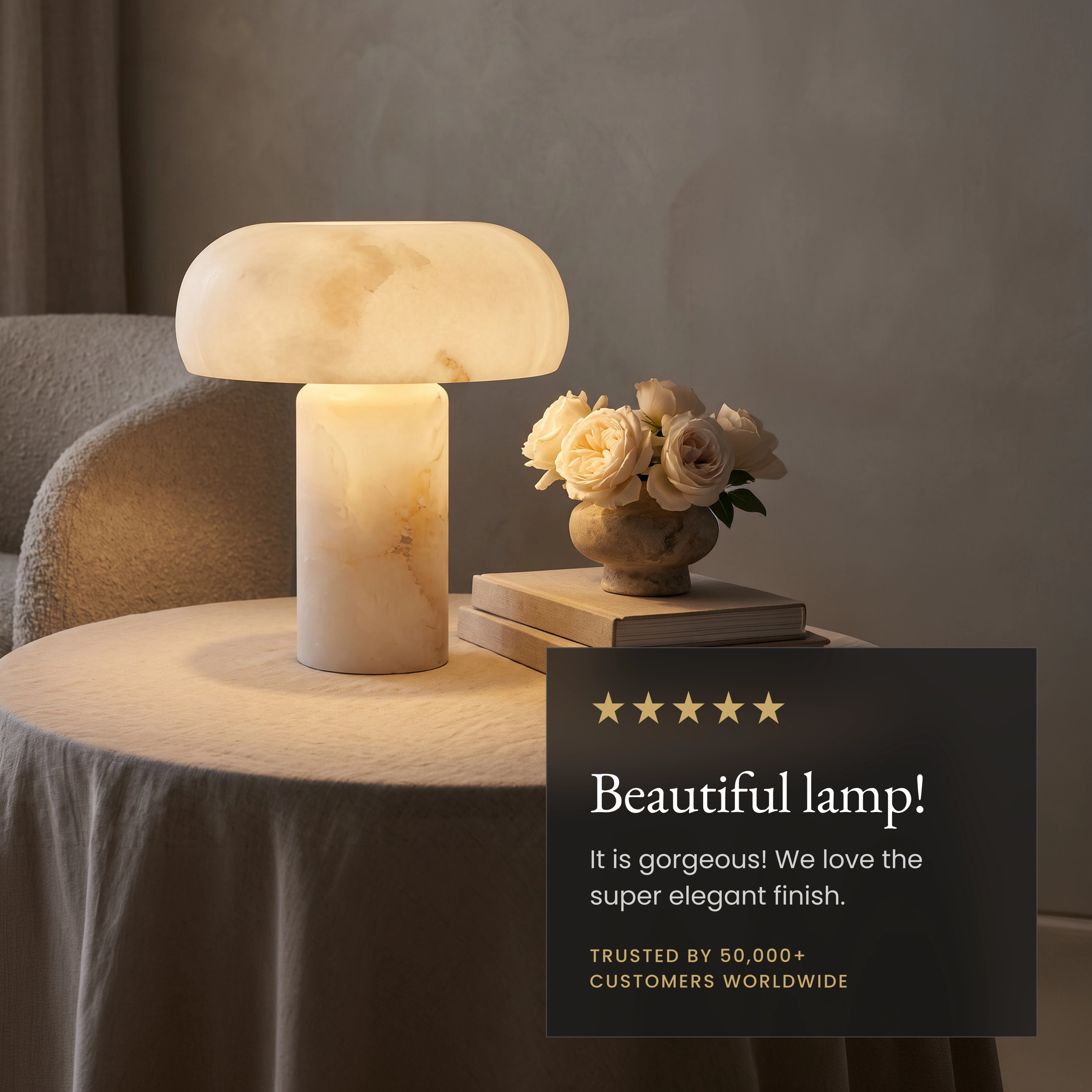 Ora Table Lamp glowing on a wood coffee table; notes no installation needed, dimmer-compatible, natural alabaster