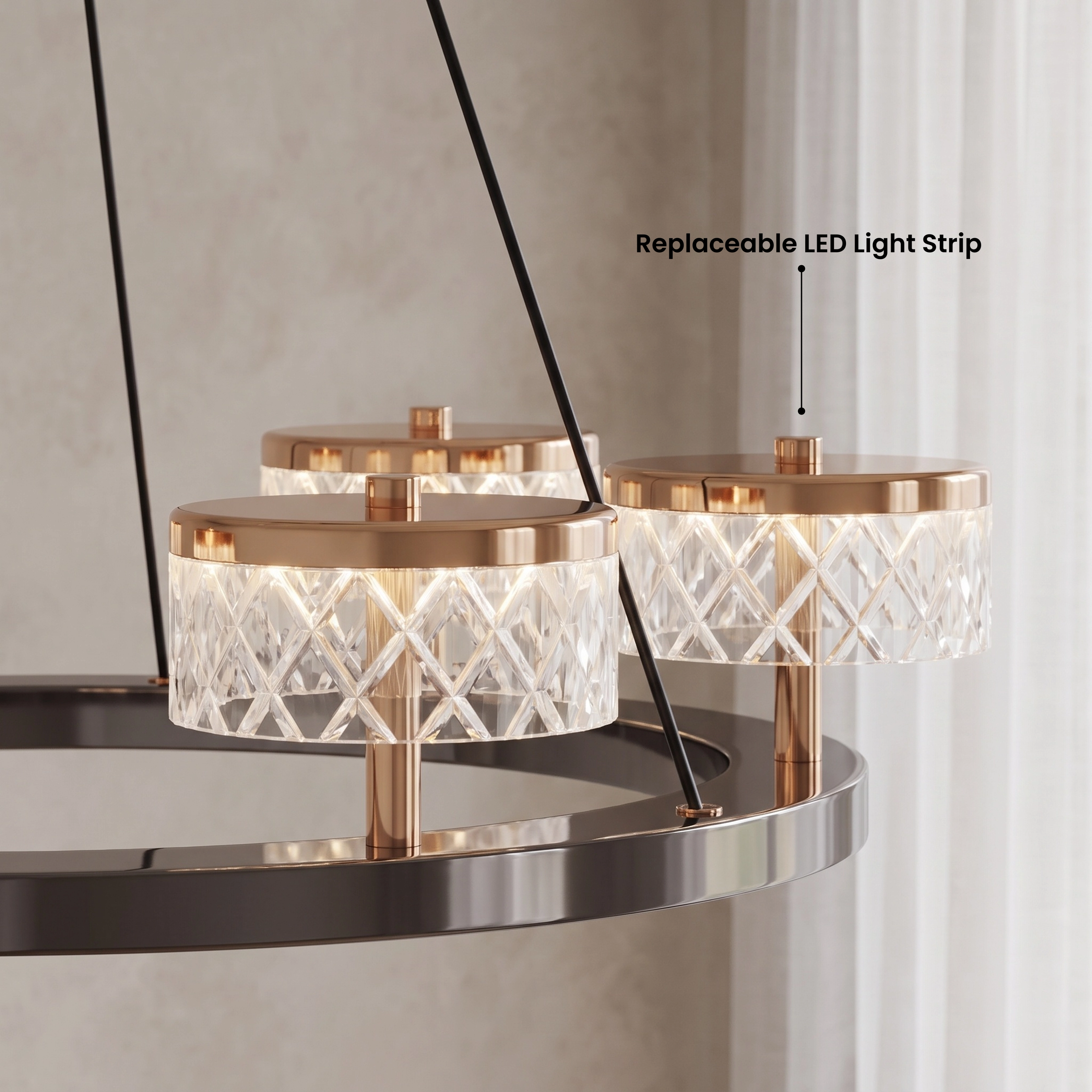 Emma two-tier chandelier, gold and pearl-black crystal drum shades, in warm white 3000K over a lounge chair