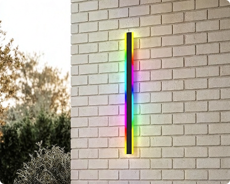 Haylen RGB smart wall light on a brick wall