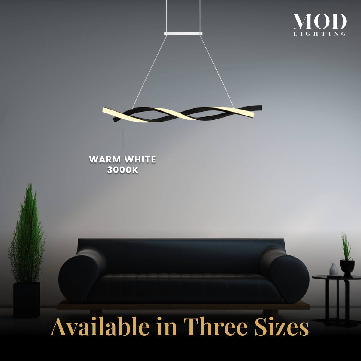 Wavey pendant, black twisted ribbon with warm-white LED, above a dark sofa; available in three sizes