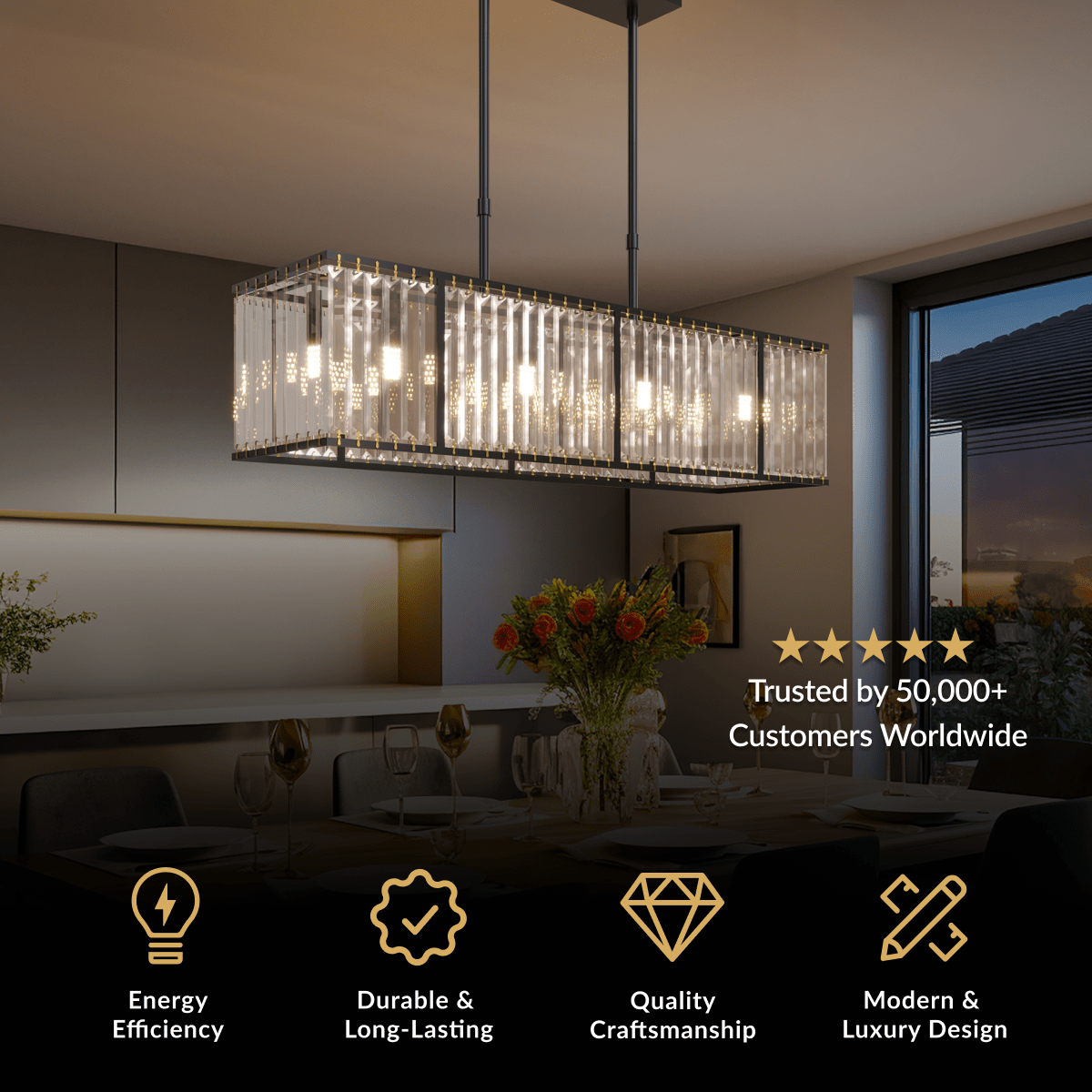 Gabriella chandelier, rectangular fringe of clear crystal rods, suspended over a dining table at dusk