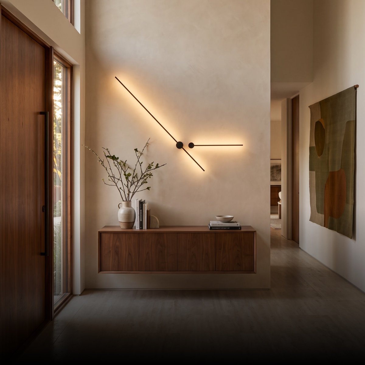 Angled linear wall light above a wood console
