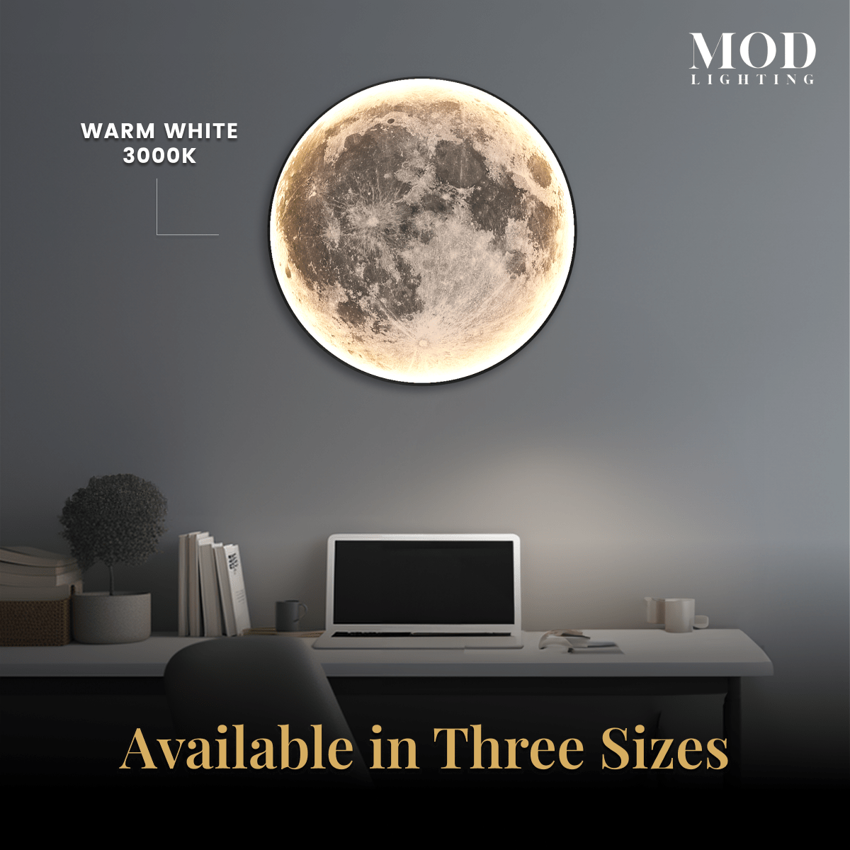 Luna moon lamp, warm white full-moon disc on a wall above a desk with a laptop