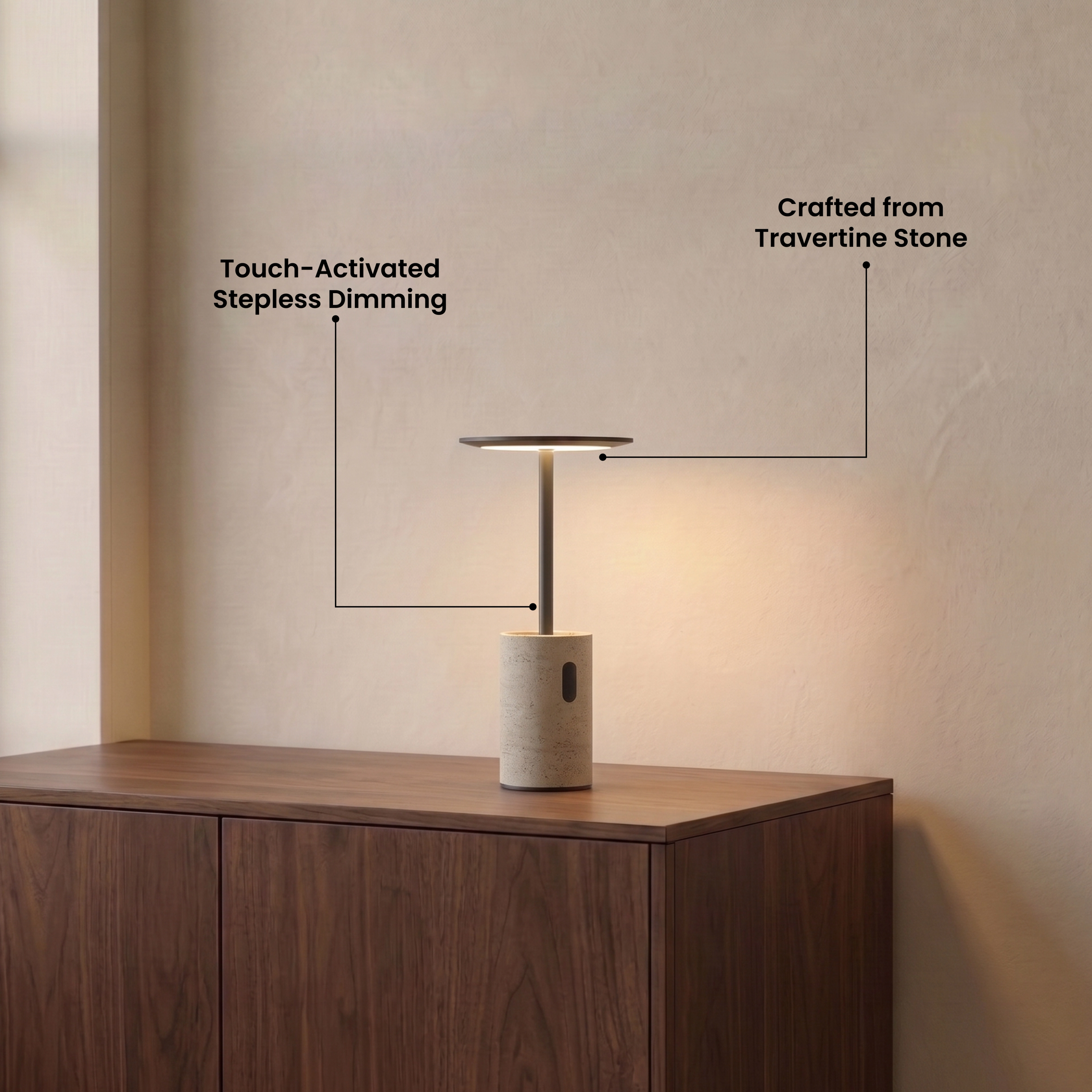 Vera travertine table lamp glowing warm white on a wood coffee table in a modern living room