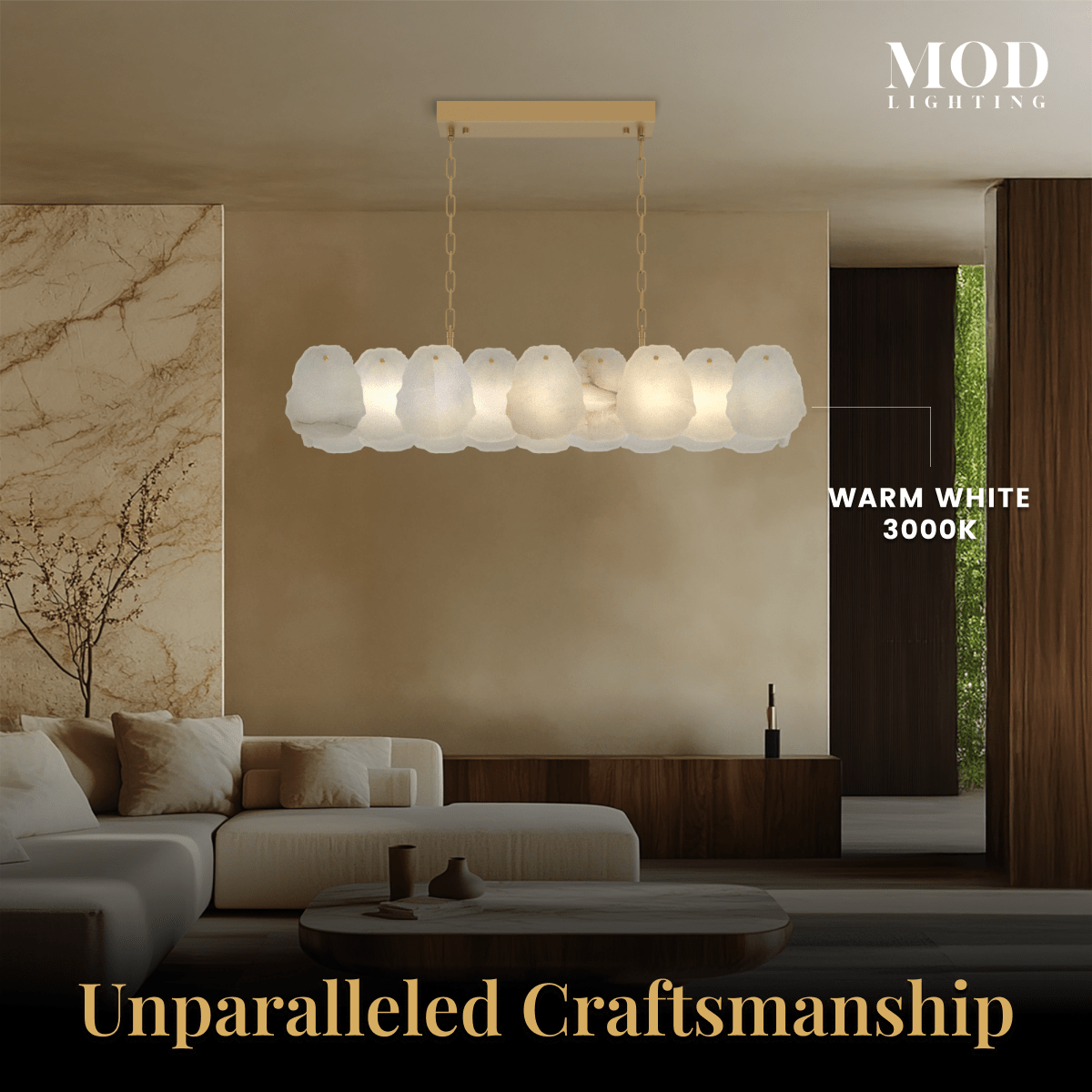 Alba Pendant glowing warm white over a beige living room, alabaster-petal linear bar on a slim gold frame