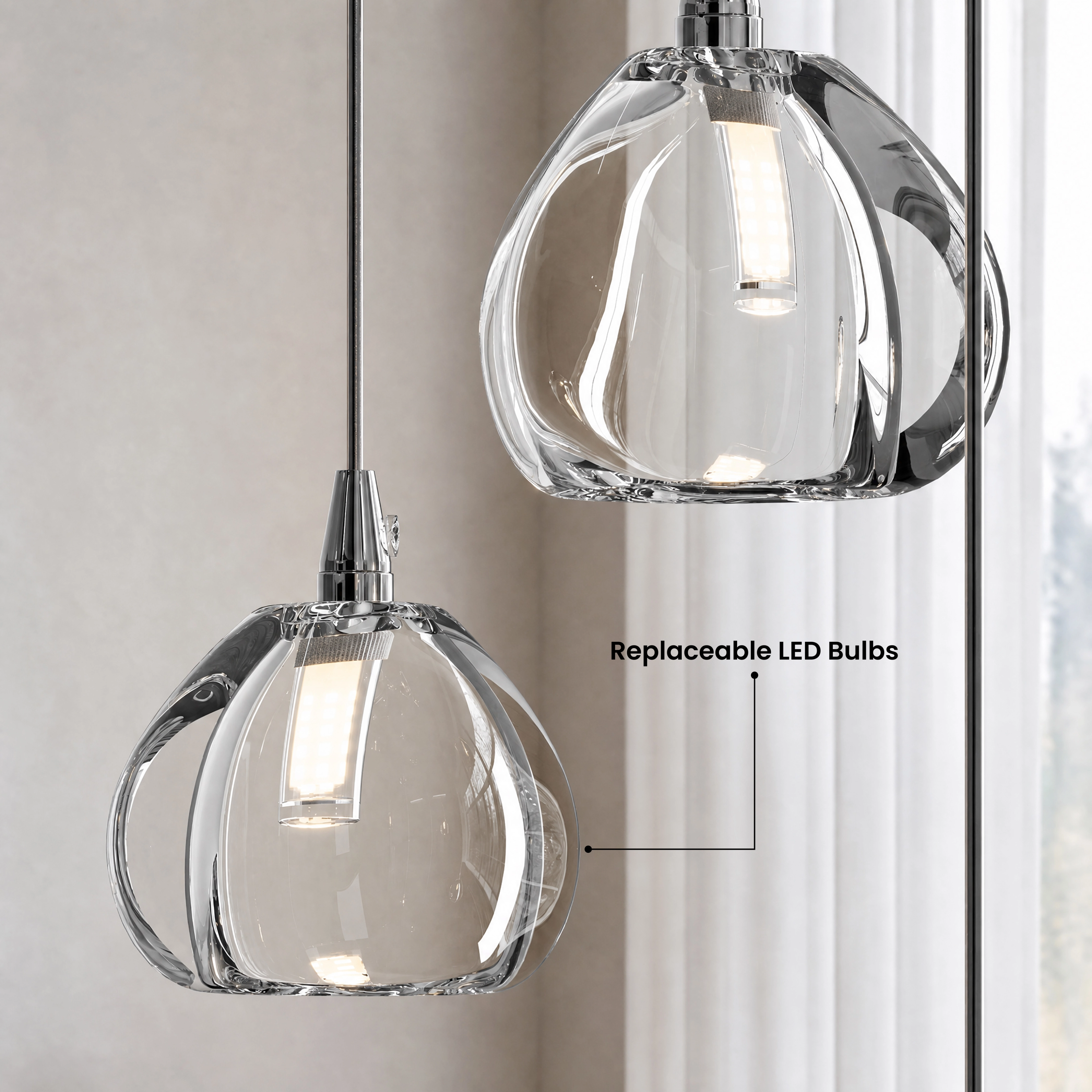 Sage clear-glass globe pendants cascading in four sizes over a media console and sofa