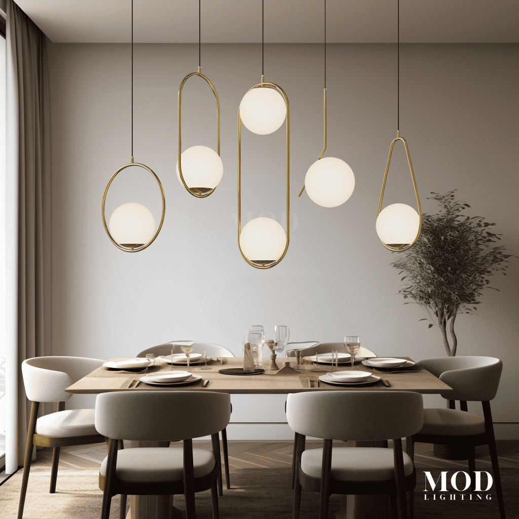 Jewels & Pearls brushed-gold pendants with white glass orbs in oval rings above a dining table