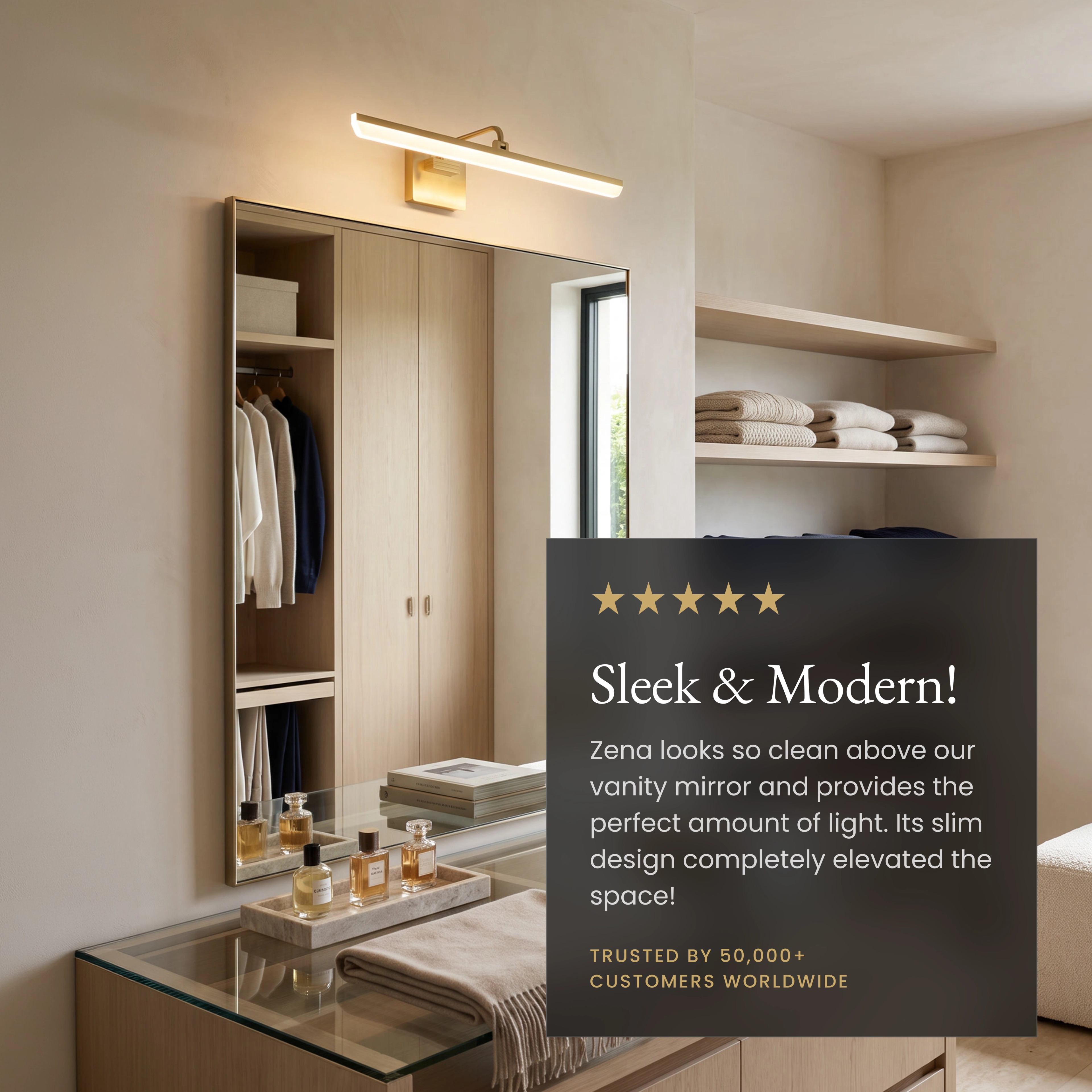 Zena slim brushed-gold horizontal bar light glowing above framed art in a hallway, moisture-proof and dimmer-compatible
