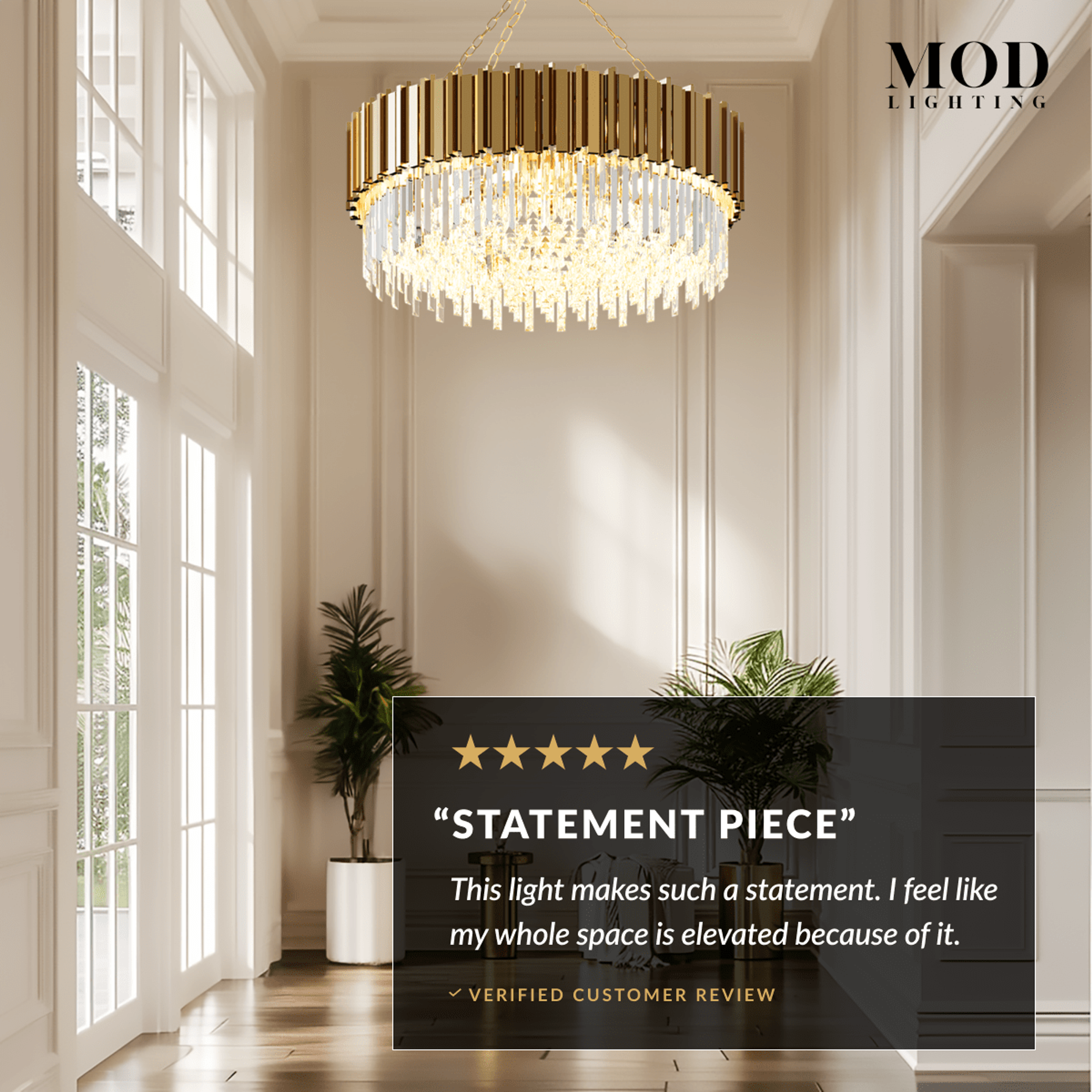 Athena gold crystal chandelier in a tall bright hallway, five-star statement-piece review overlay