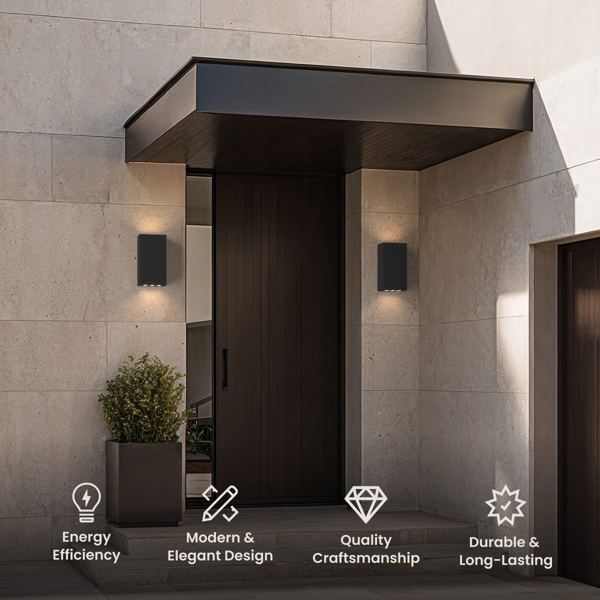 Harlow, black up-and-down box outdoor sconces on a stone exterior wall beside a wood door