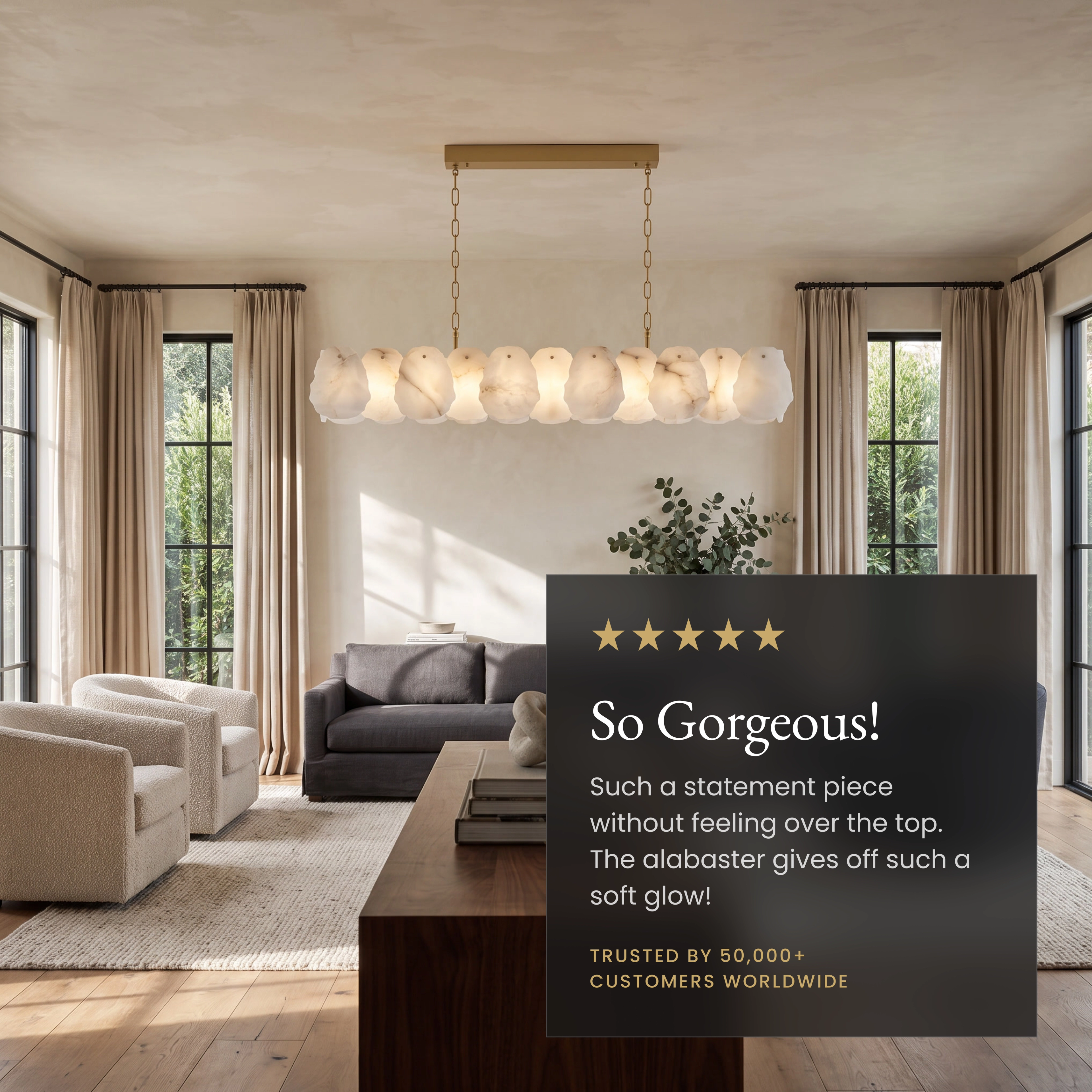 Alba Pendant, alabaster-petal linear bar on gold frame over a marble desk; notes adjustable length and dimmer compatibility