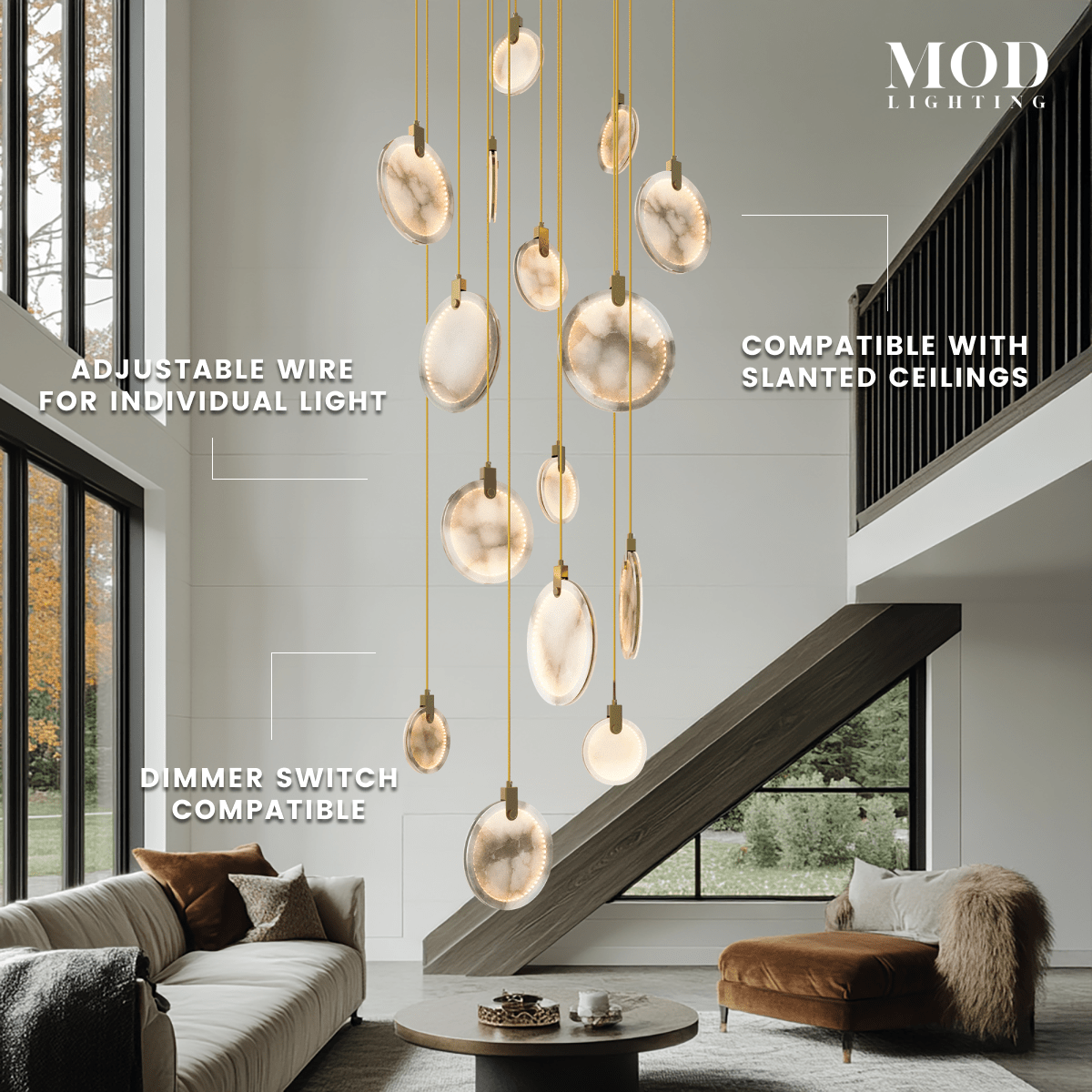Marble alabaster-disc pendant cluster cascading in a two-story living room; adjustable wire, slanted-ceiling ready