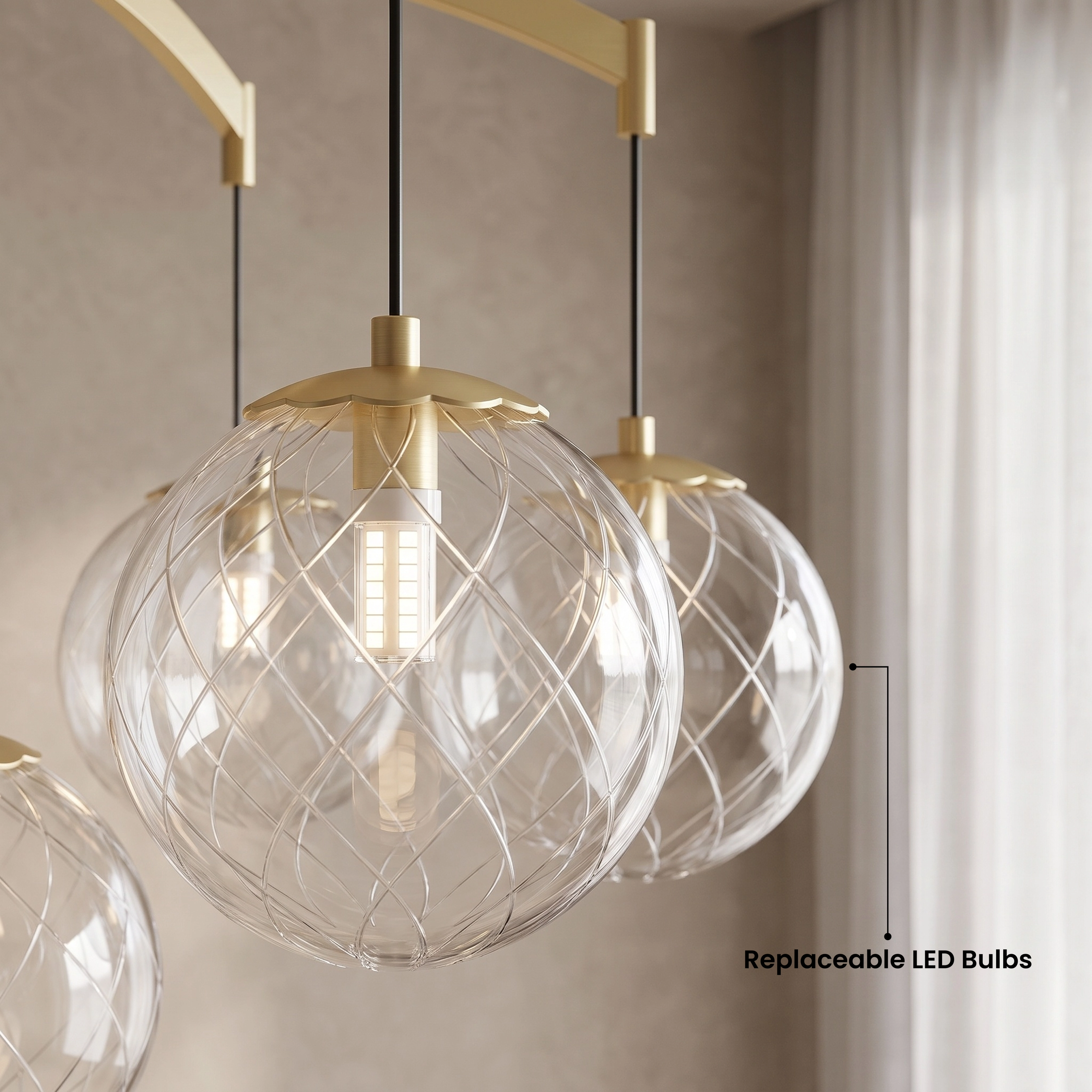 Mirella brushed-gold globe chandelier and matching sconces lighting a warm neutral bathroom with round mirror