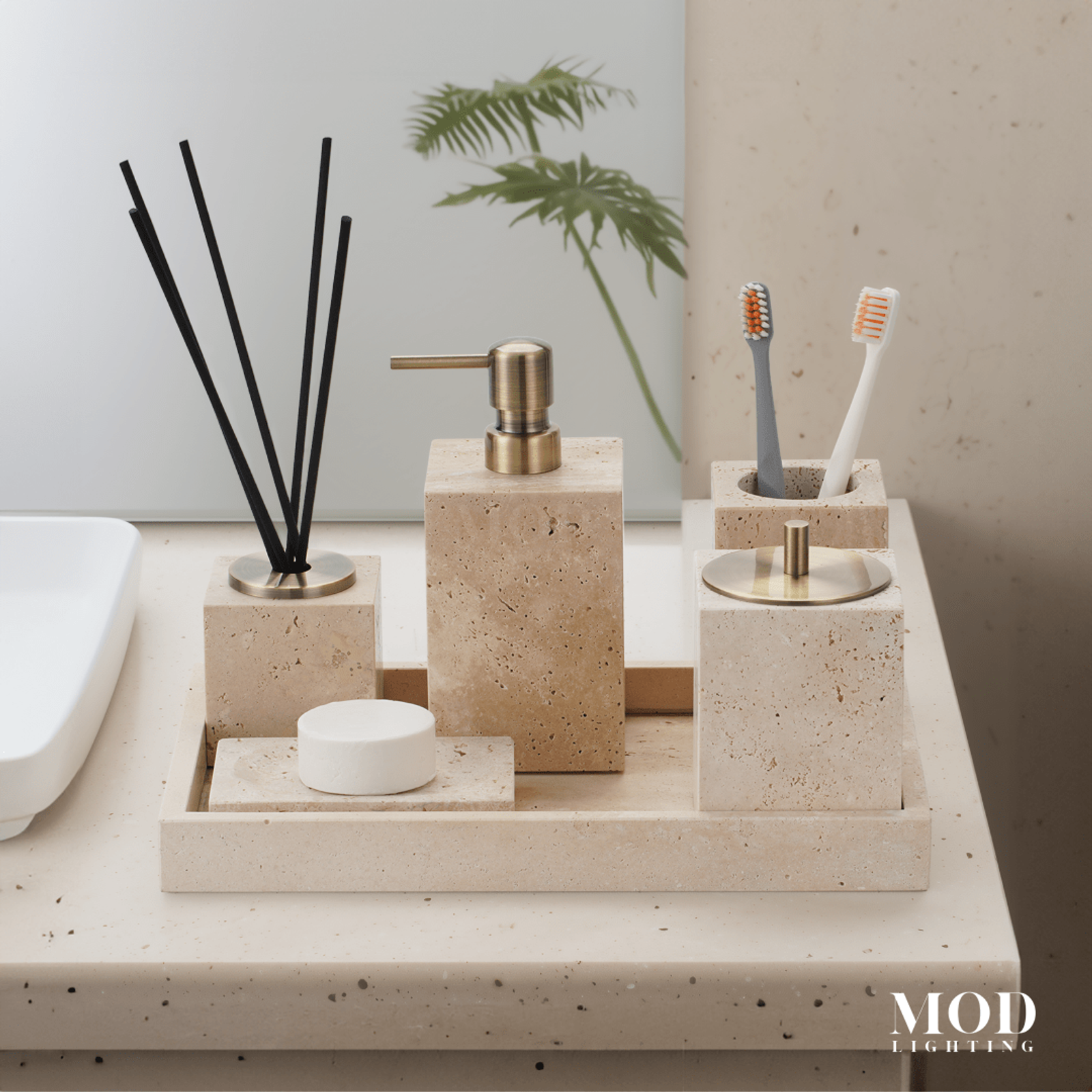 Golden Travertine Stone Bath Set with soap pump, toothbrush holder, jar and tray on a vanity