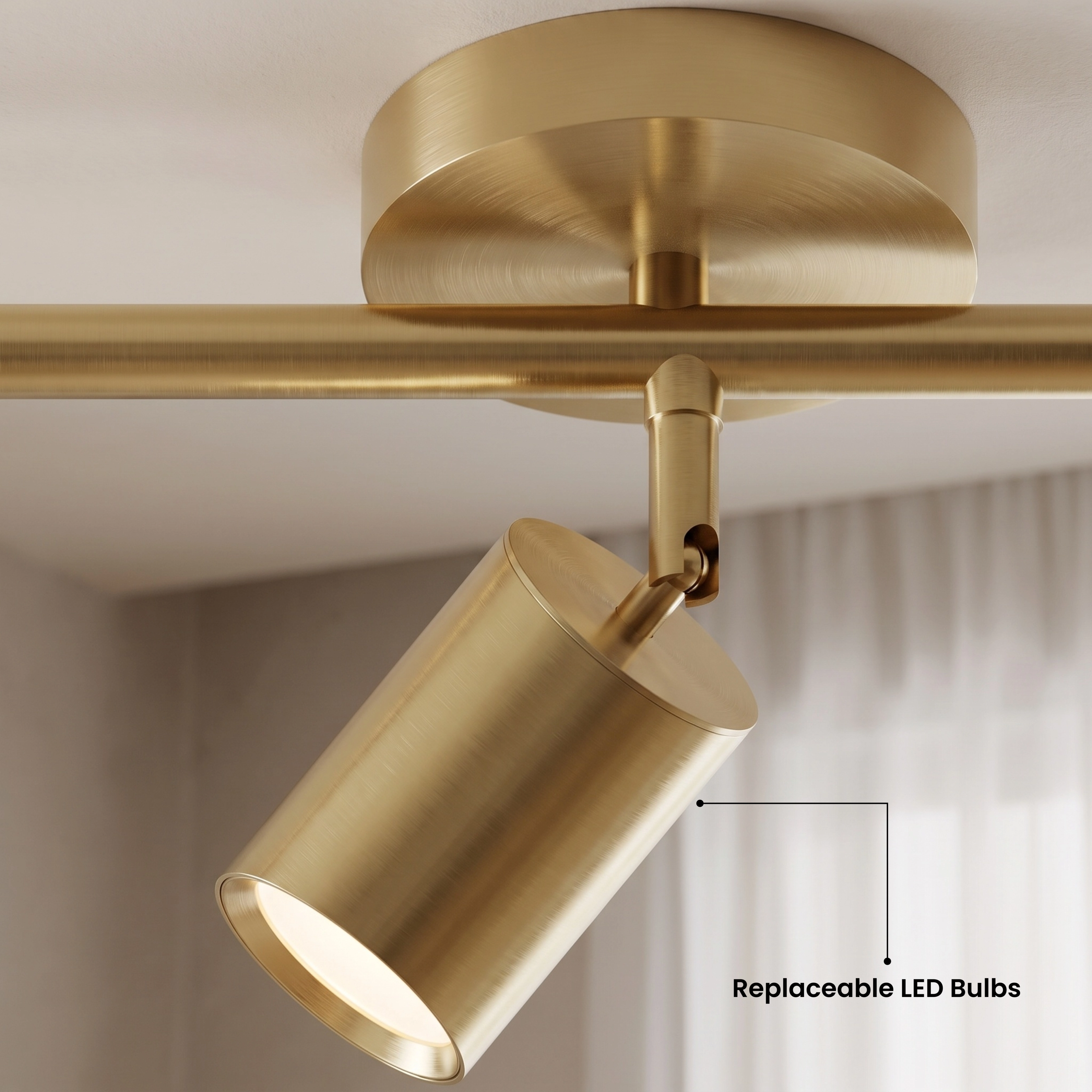Harris black cylinder track light on a panelled wall glowing warm white, noting five sizes and two finishes