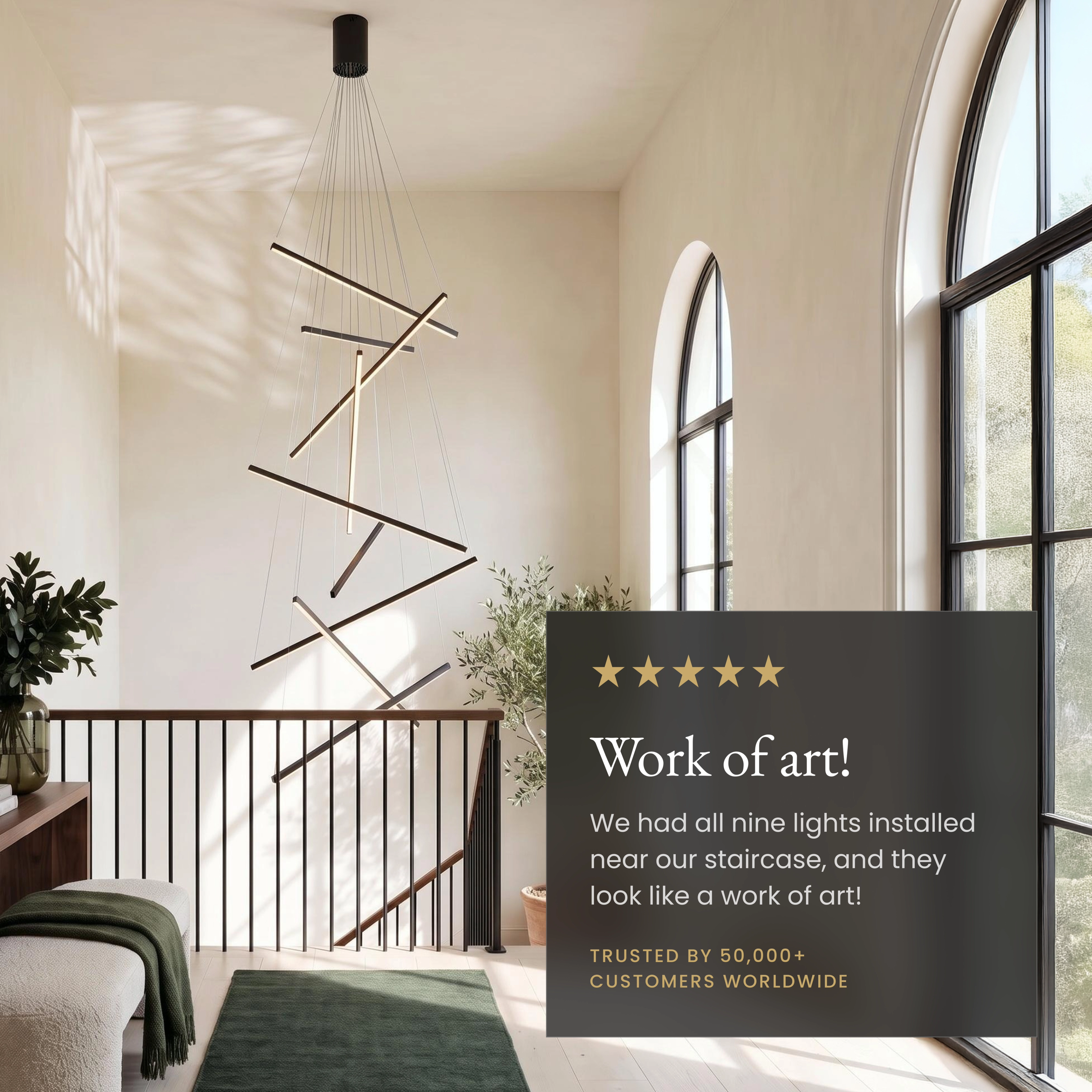 Finn black staggered light-bar chandelier over a sofa, labeled dimmer, adjustable wire, slanted-ceiling fit
