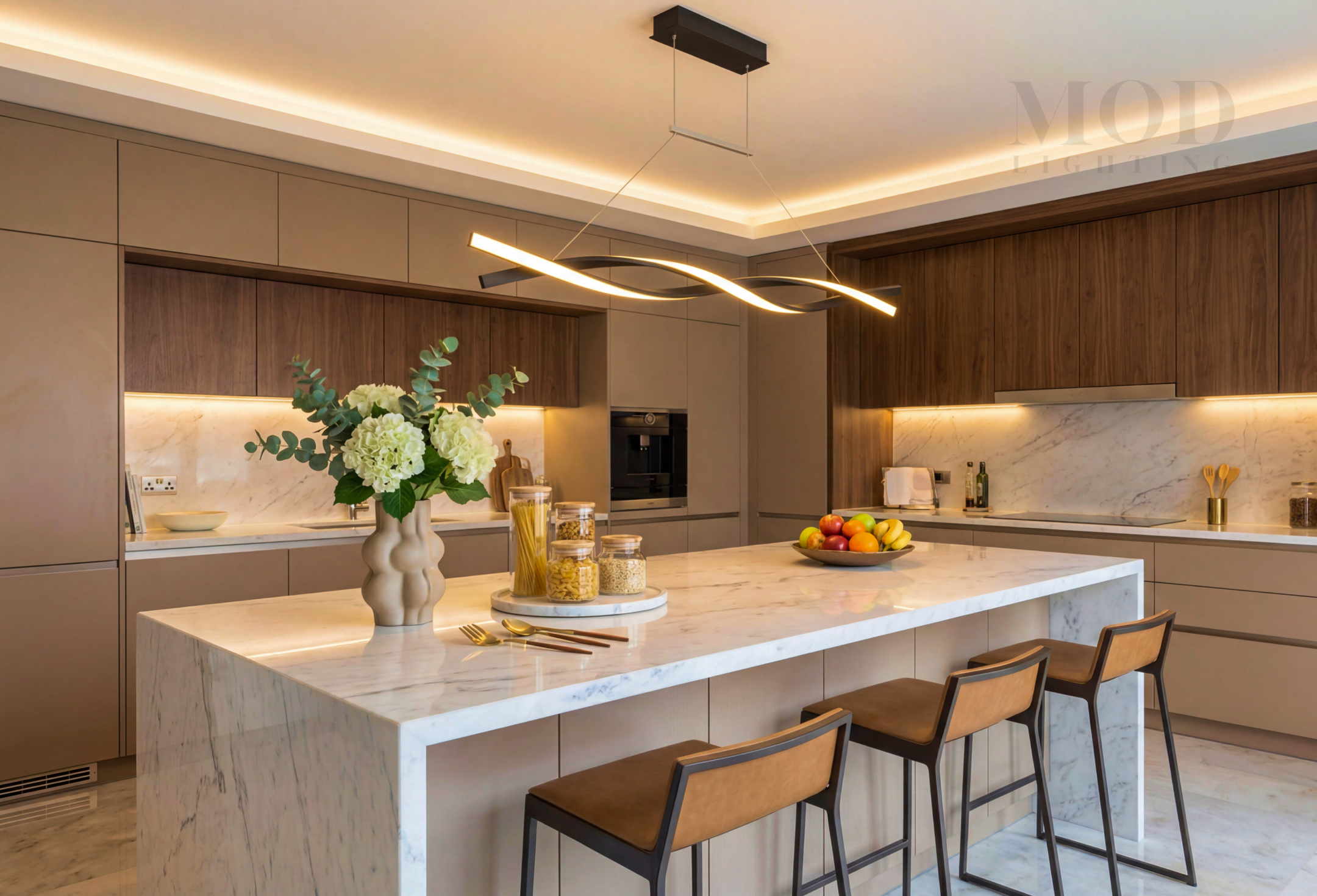 Modern kitchen w pendant lights providing warm task lighting