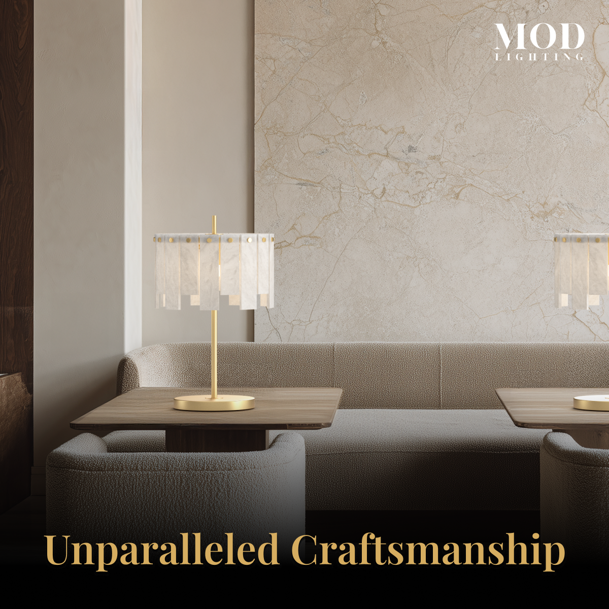 Velina Table Lamp gold base with panelled alabaster shade on a low table in a warm-toned seating area
