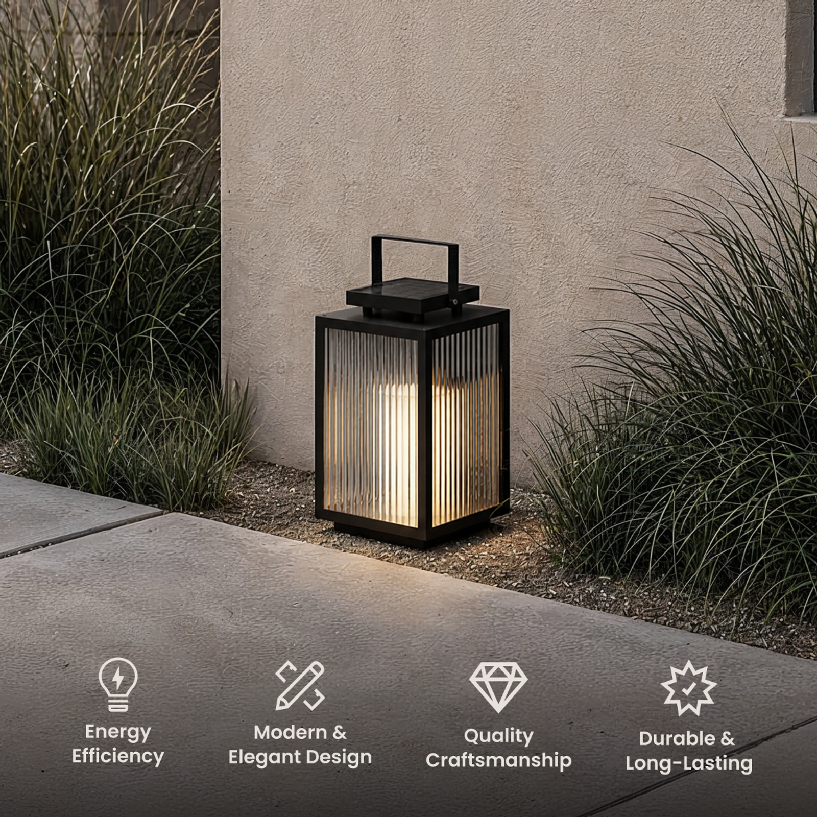 Beacon black solar lantern on a garden path beside ornamental grasses, with energy, design and durability icons