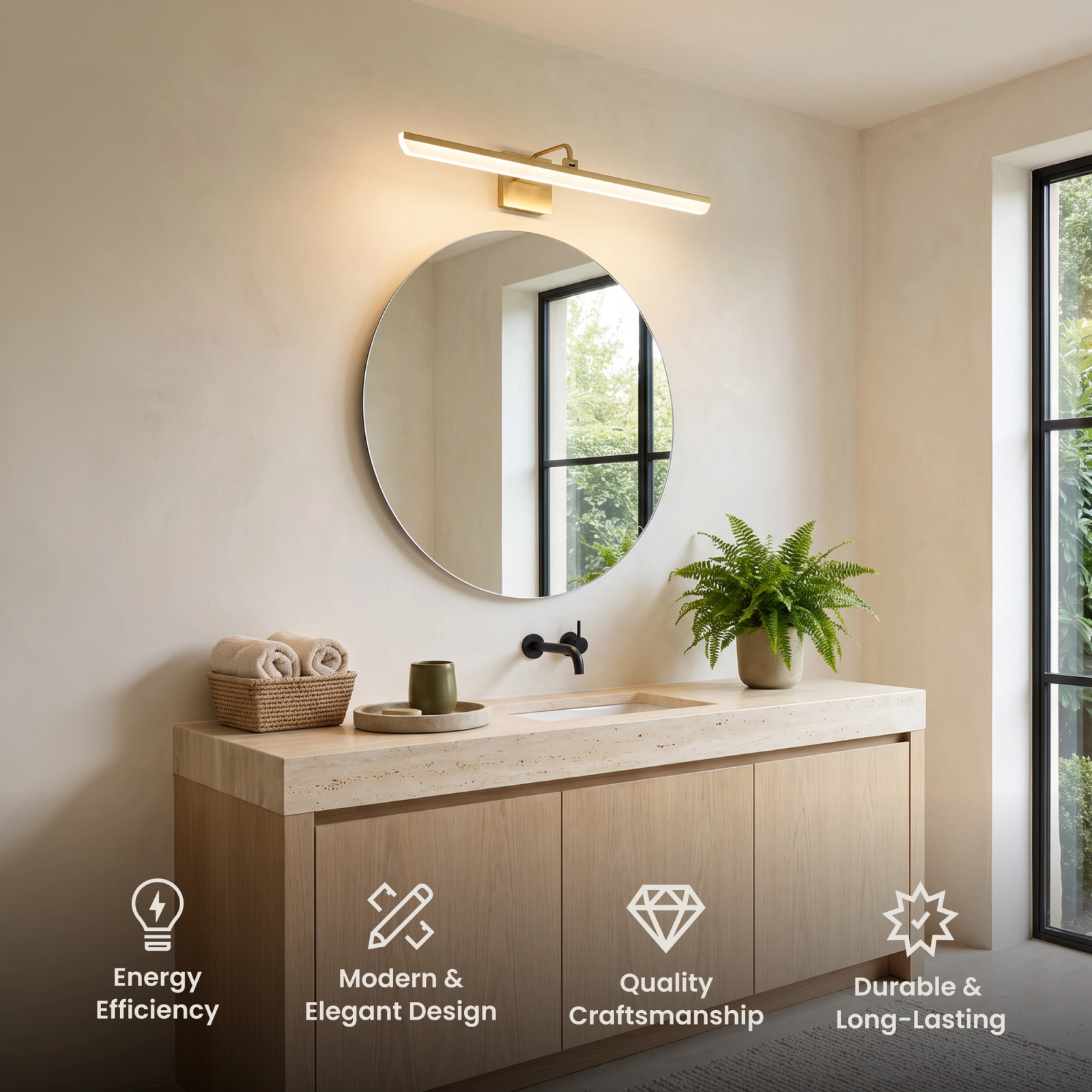 Zena bathroom light in brushed gold, slim horizontal bar mounted above a black-framed mirror on a dark wall