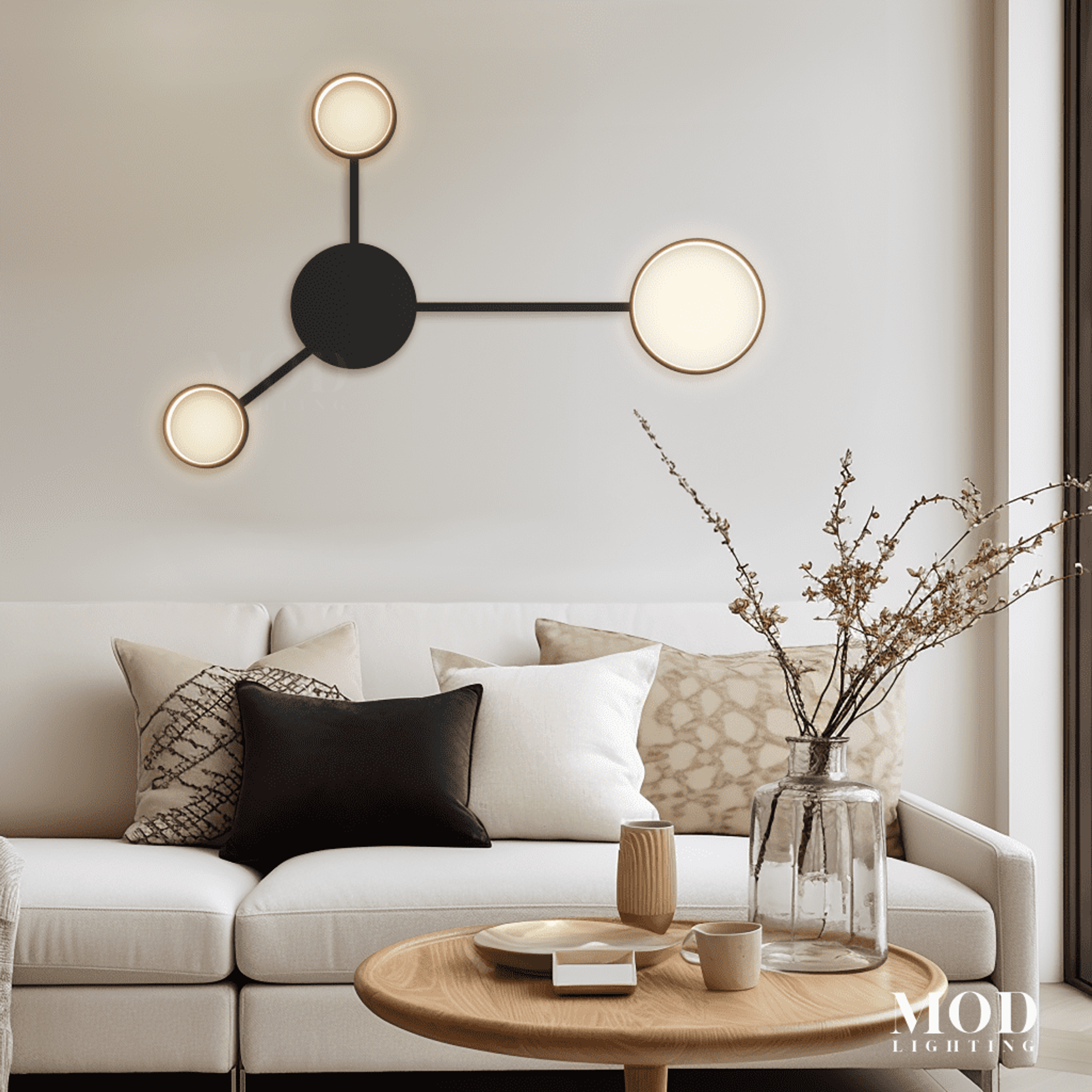 Link wall light, black bar with three round backlit discs, on a wall above a sofa