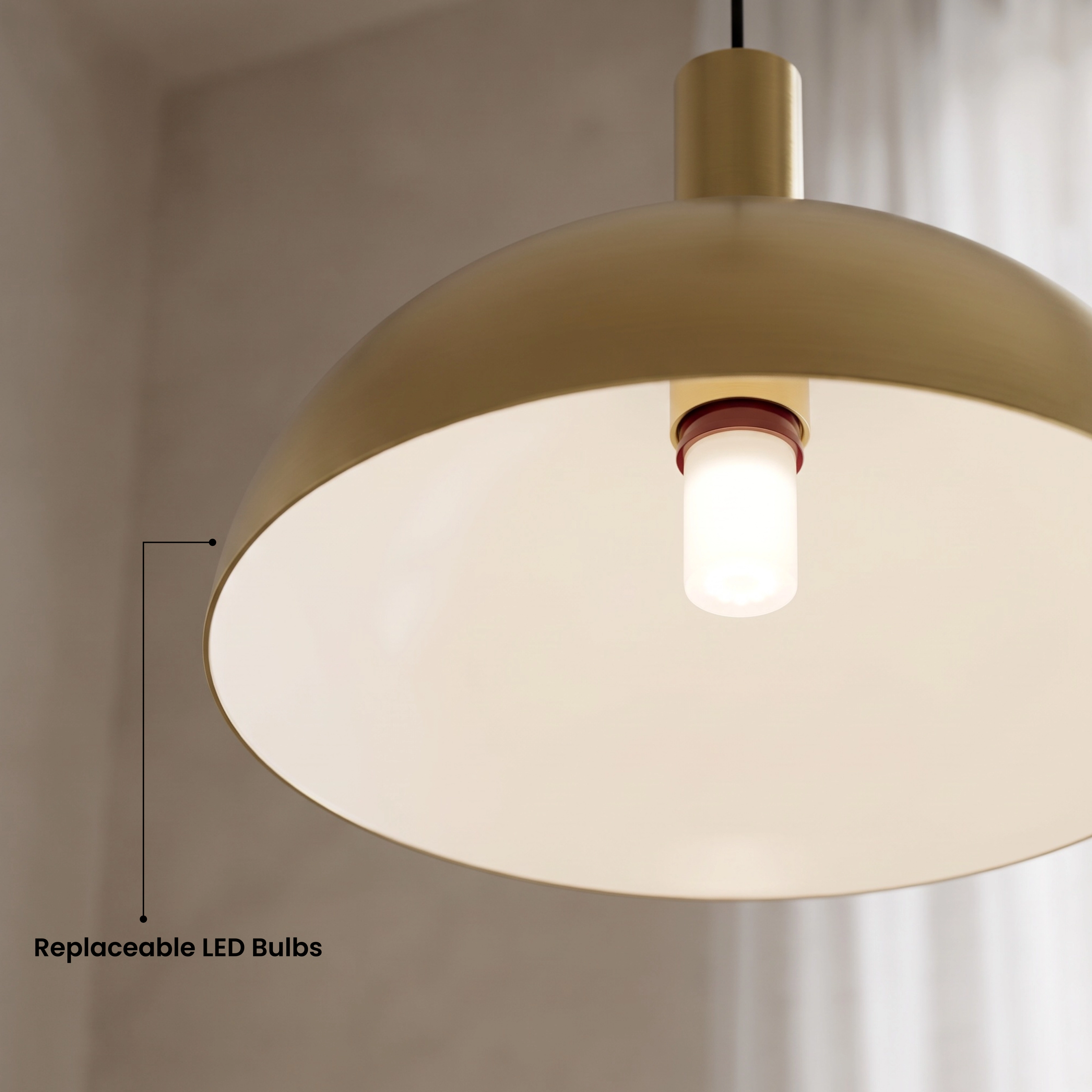 Kinsley gold dome pendants over a kitchen island, labeled available in matte black and brushed gold