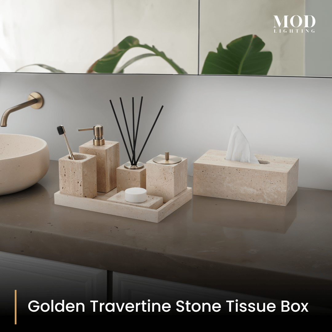 Golden Travertine tissue box with matching beige stone bath set on a tray on a dark vanity