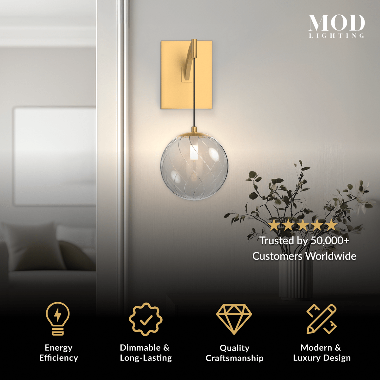 Mirella Sconce, single clear glass globe on a brushed gold wall-mounted arm