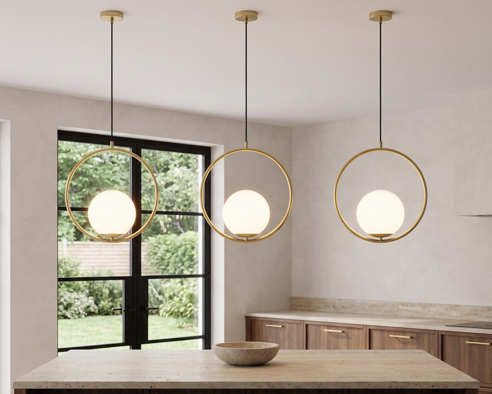 Three Jewels & Pearls pendants over a kitchen island