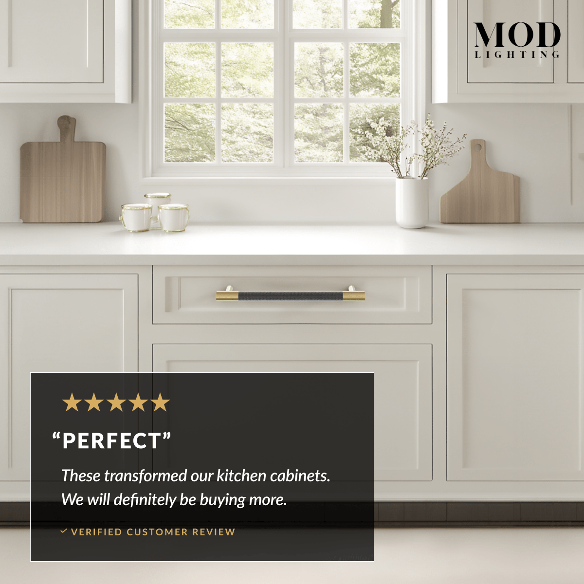 Wellington black-and-gold cabinet pull on white kitchen drawer with a five-star customer review overlay reading Perfect