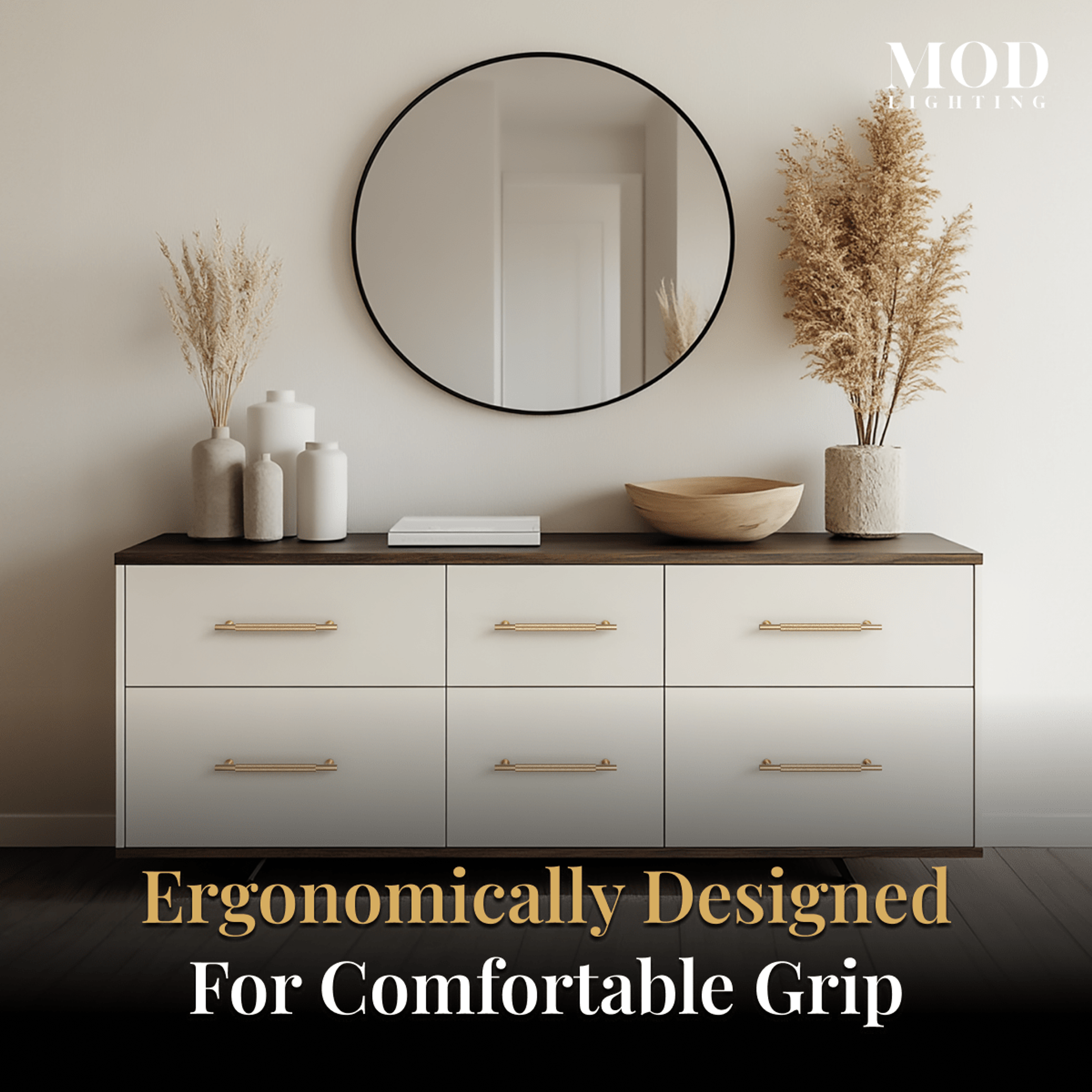 Wellesley brushed-gold cabinet pulls on white dresser drawers below a round mirror in a neutral styled bedroom