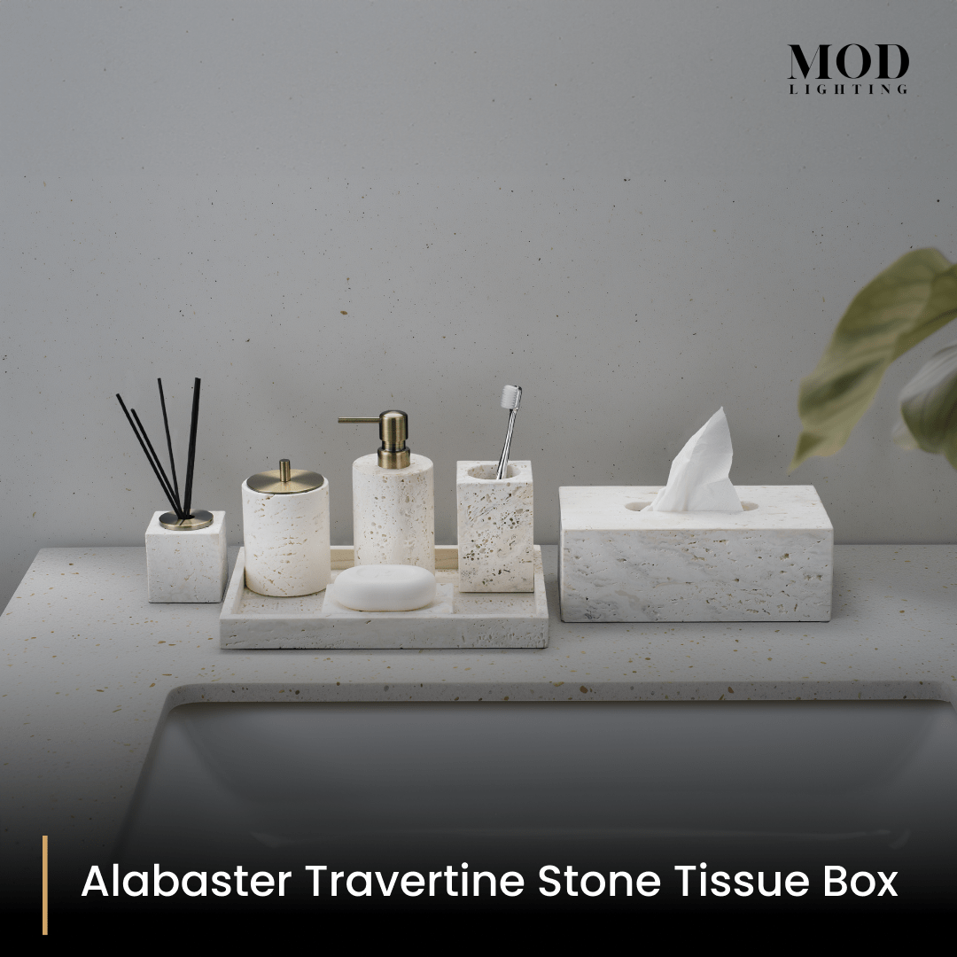 Alabaster Travertine tissue box with the cream stone bath set arranged on a tray on a light vanity