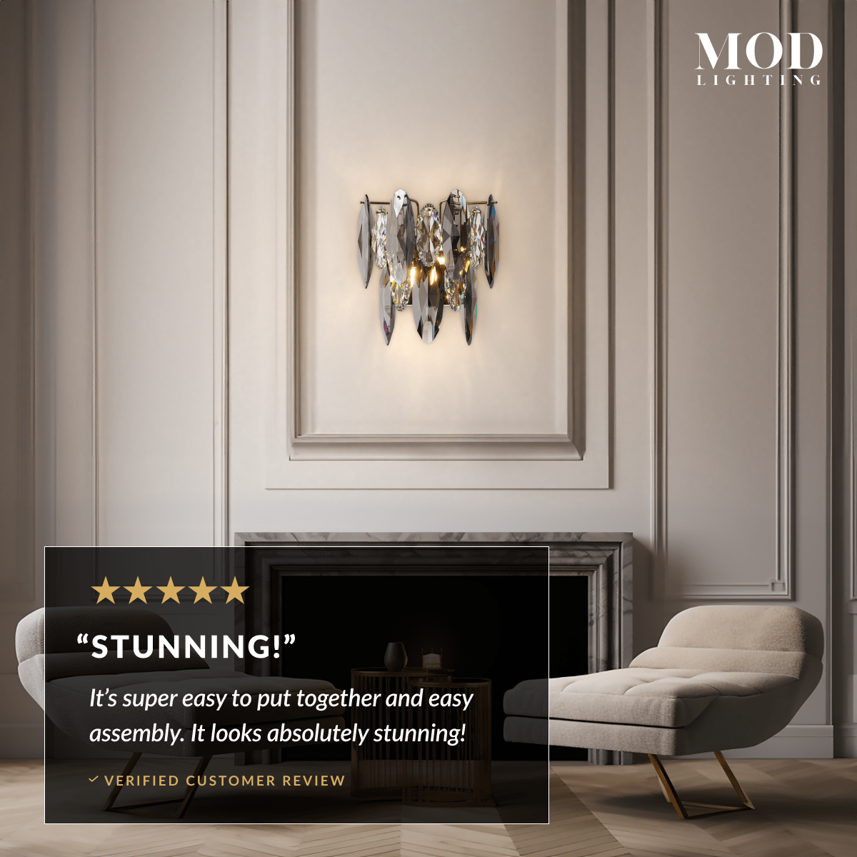 Celestial gold and smoke-crystal wall sconce on a panelled wall by a fireplace, customer review overlay