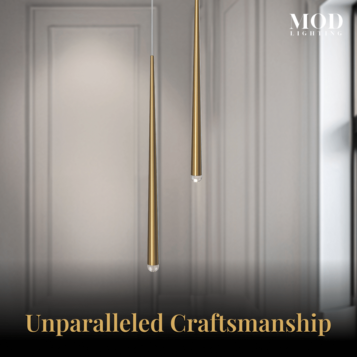 Jasper gold tapered spike pendants, close view of two slim brass cones against a paneled wall