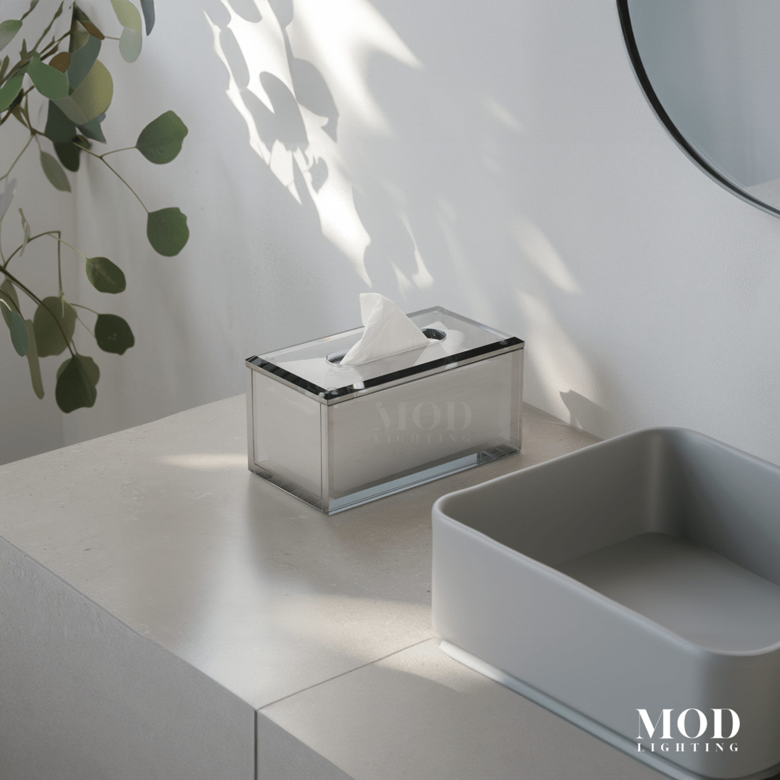 Moonlit Crystal Tissue Box, clear smoked-glass holder on a white counter by a mirror