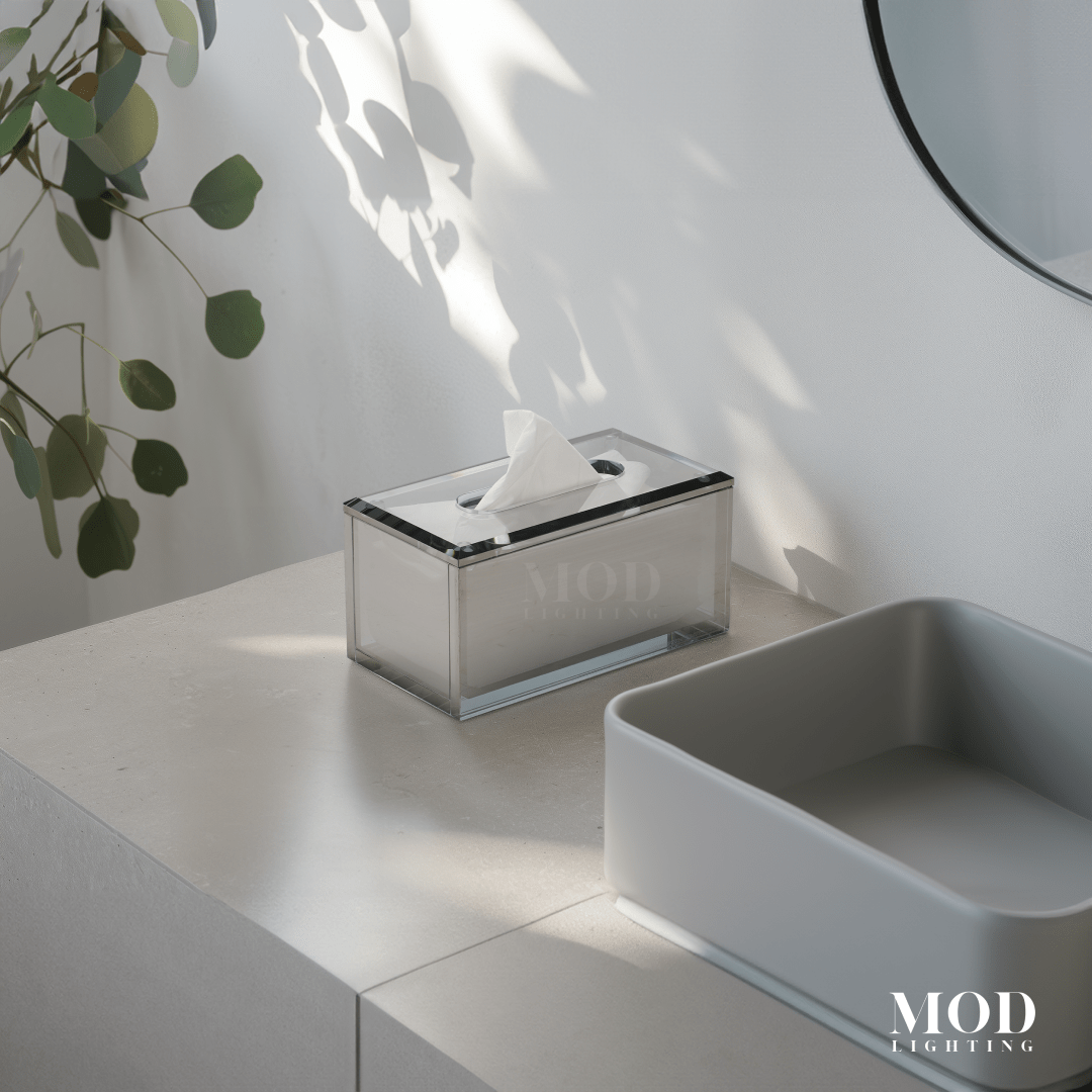 Moonlit Crystal Tissue Box, clear smoked-glass holder on a white counter by a mirror